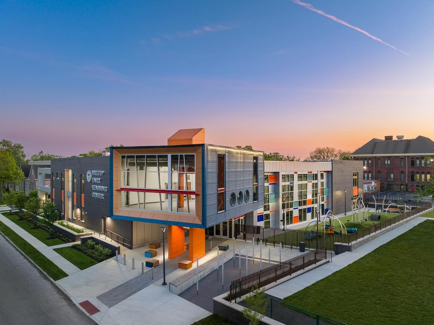An aerial view at dusk of the Hilltop Early Learning Center, capturing the outdoor sound garden and play area 🌅✨.
&bull;
&bull;
&bull;
&bull;
&bull;
#bbcodesign #architecture #interiors#interiordesign #design #bbco #columbus#minorityfirm #womanowned