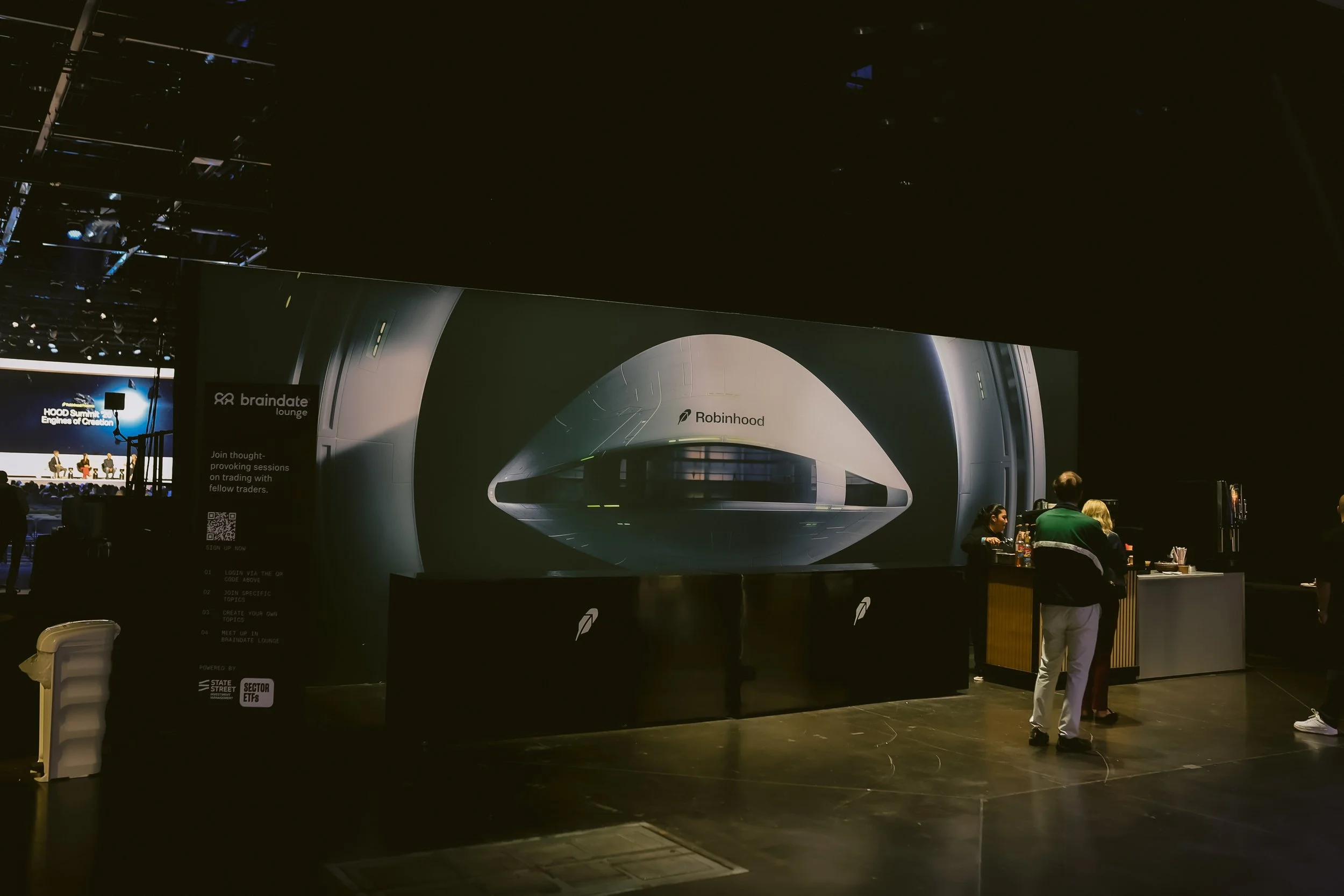 Robinhood branded spaceship graphic wall near the Braindate Lounge at HOOD Summit '26