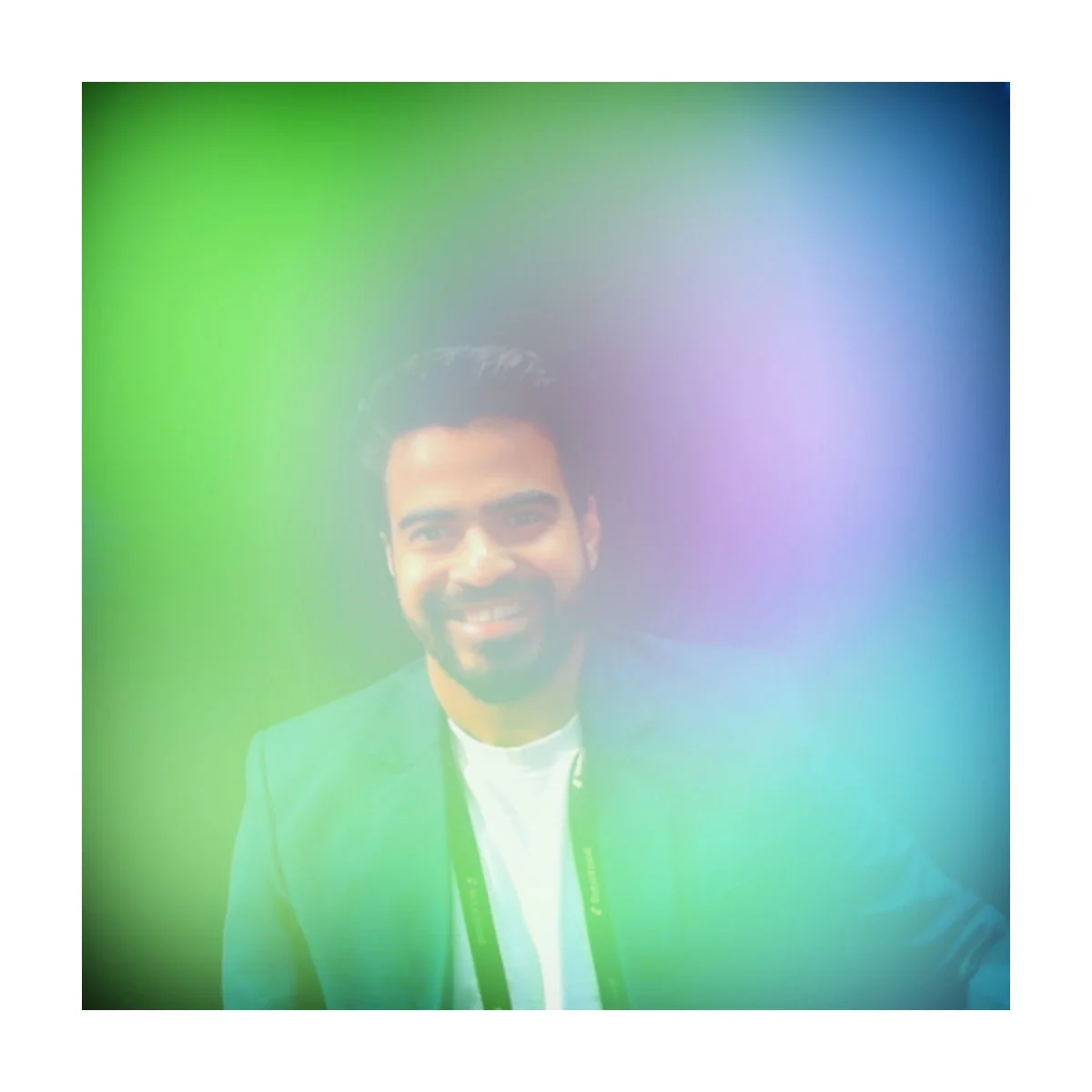 Aura portrait of a guest in a green and blue glow, Fox & Darling aura photo booth