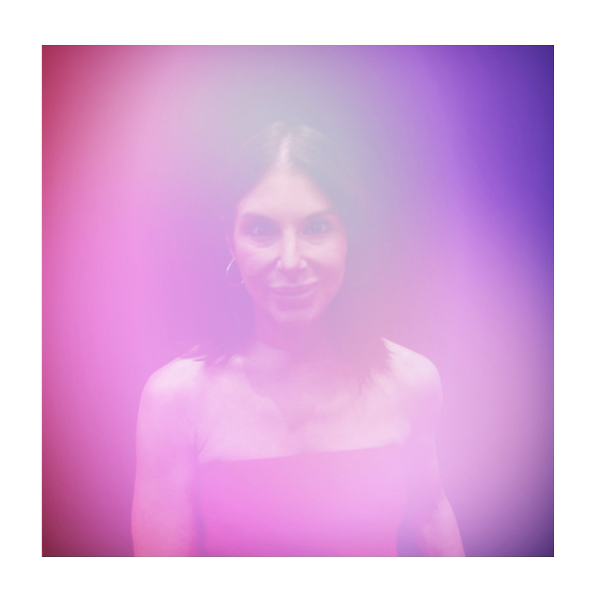 Aura portrait of a guest in a pink and purple glow, Fox & Darling aura photo booth