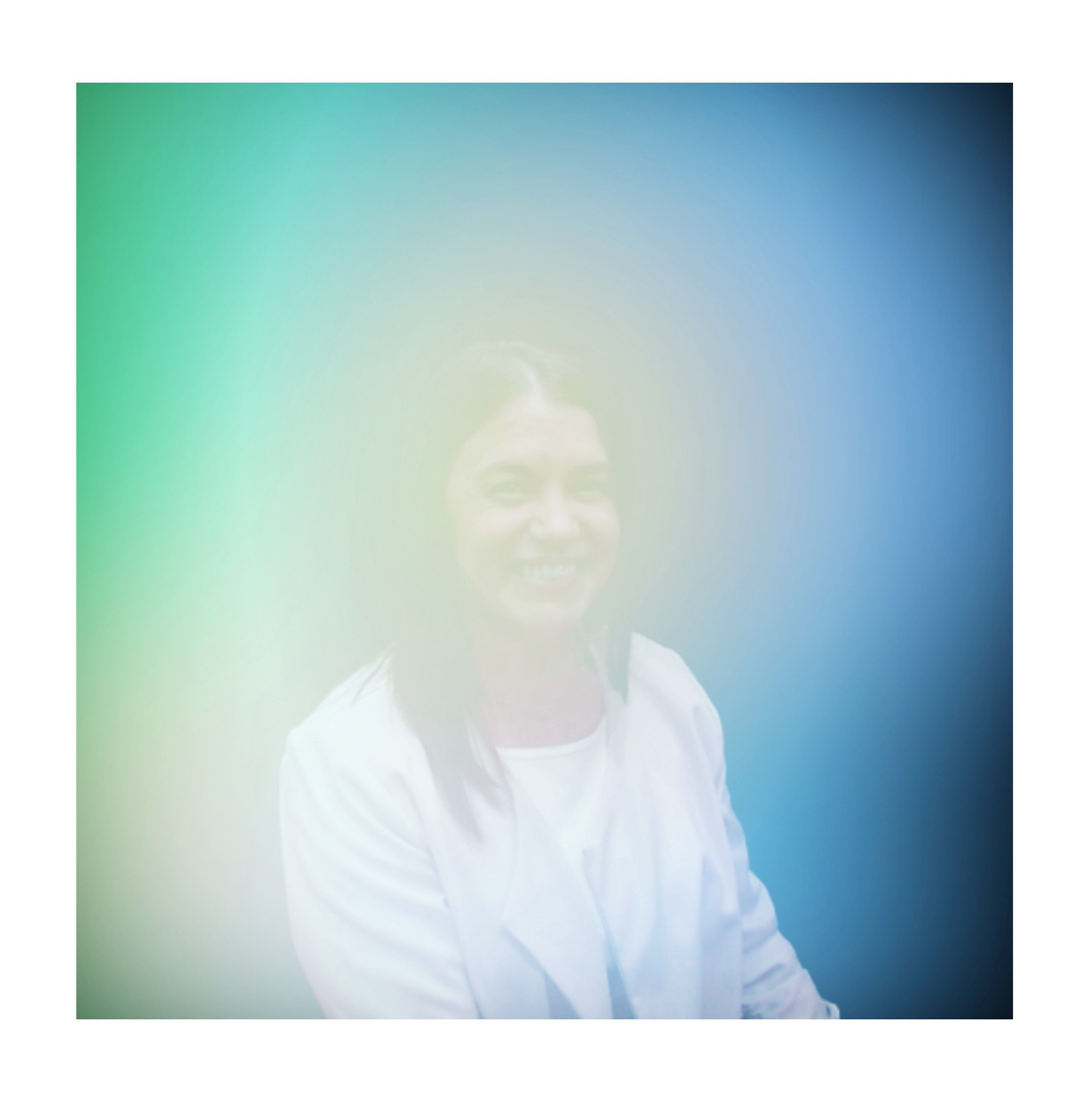 Aura portrait of a guest in a teal and blue glow, Fox & Darling aura photo booth