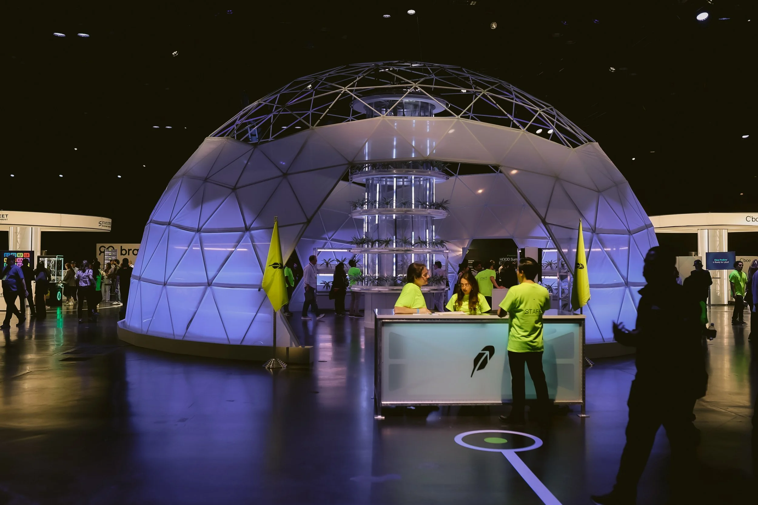 Robinhood's illuminated geodesic dome centerpiece on the sponsor floor at HOOD Summit '26 in Houston