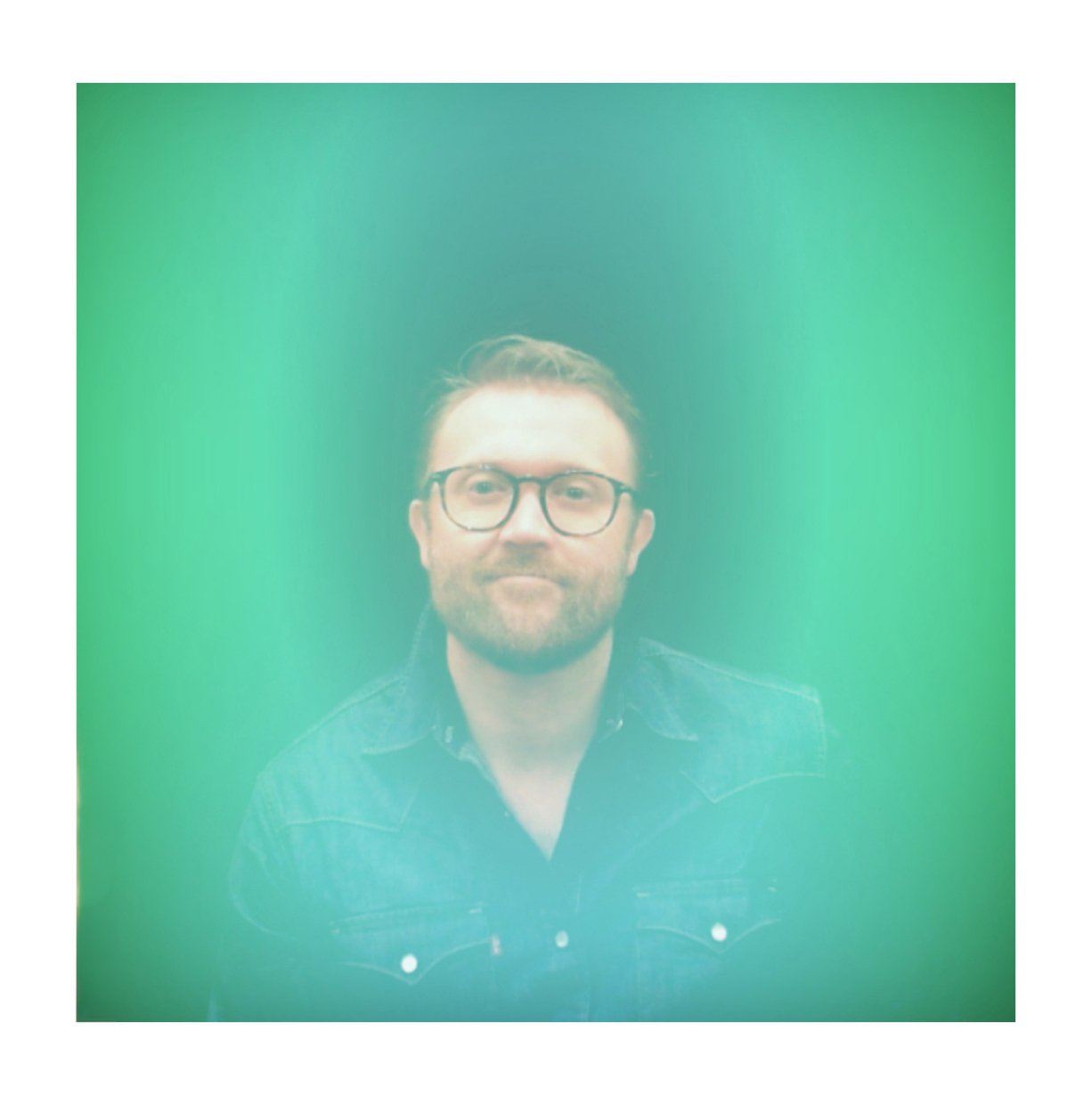 Aura portrait of a guest in a green and teal glow, Fox & Darling aura photo booth