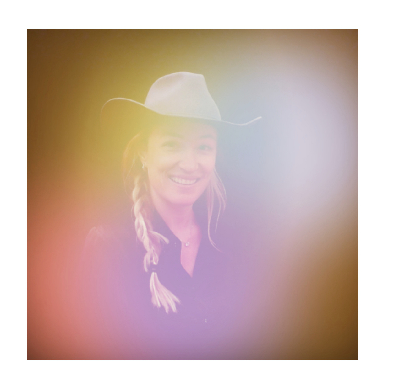 Aura portrait of a guest in a gold and violet glow, Fox & Darling aura photo booth