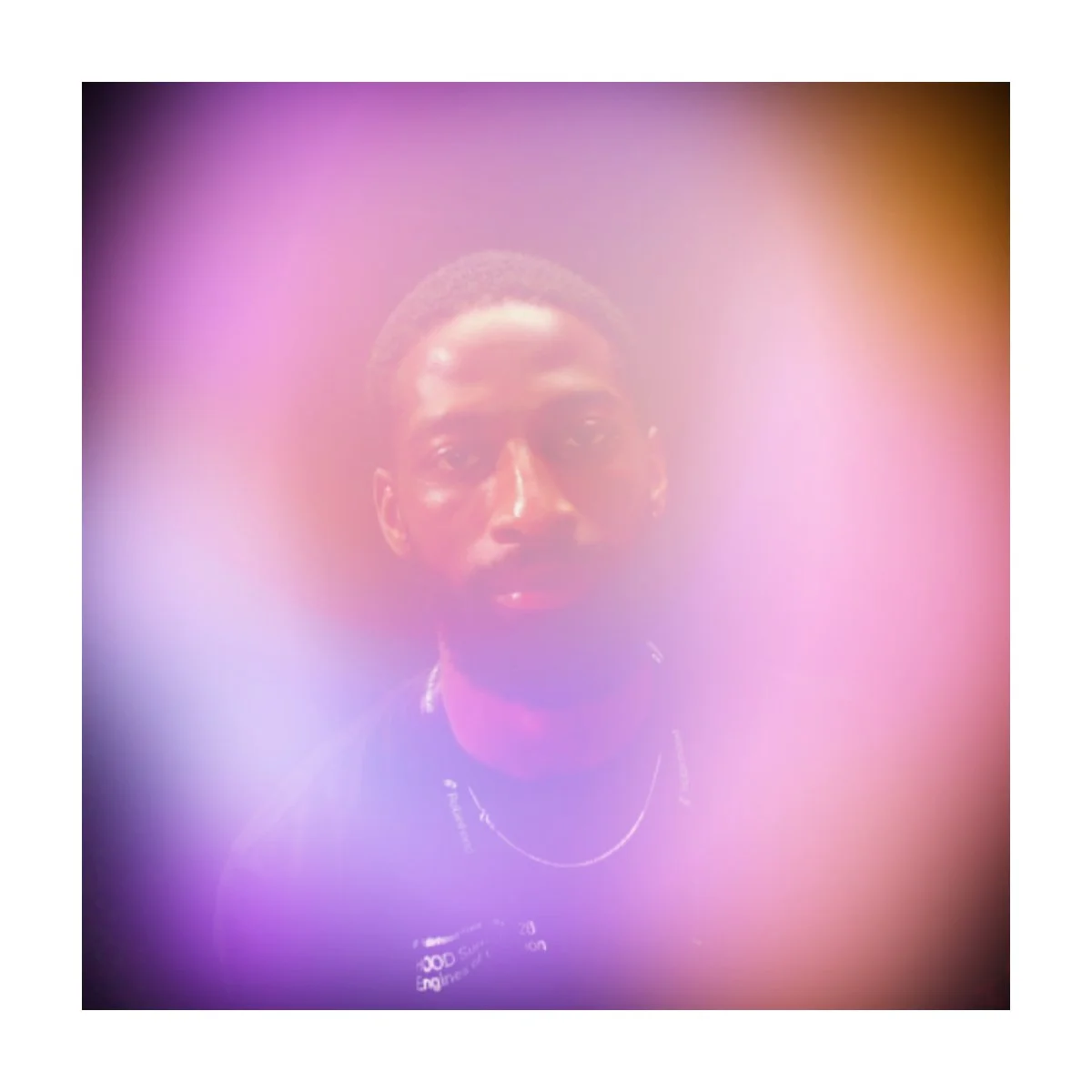 Aura portrait of a guest in a purple and orange glow, Fox & Darling aura photo booth