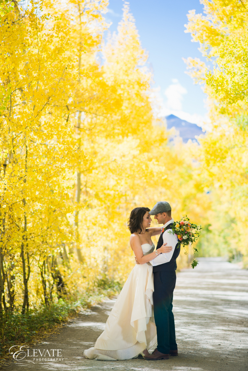 Fall wedding in Breckenridge | RIVINI Martini gown from Little White Dress Bridal Shop | Elevate Photography