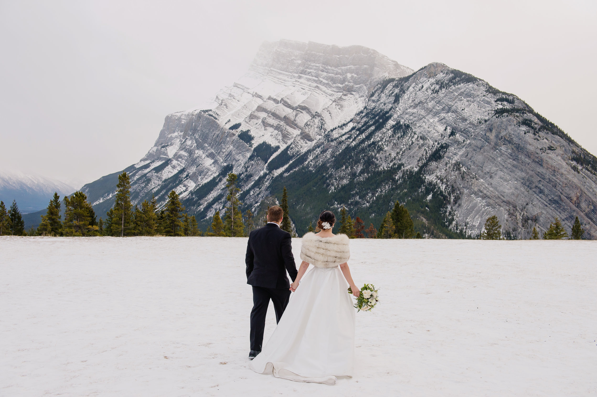 Winter wedding in Banff, Canada | Anne Barge Harlequin gown from Little White Dress in Denver, Colorado | Orange Girl Photography