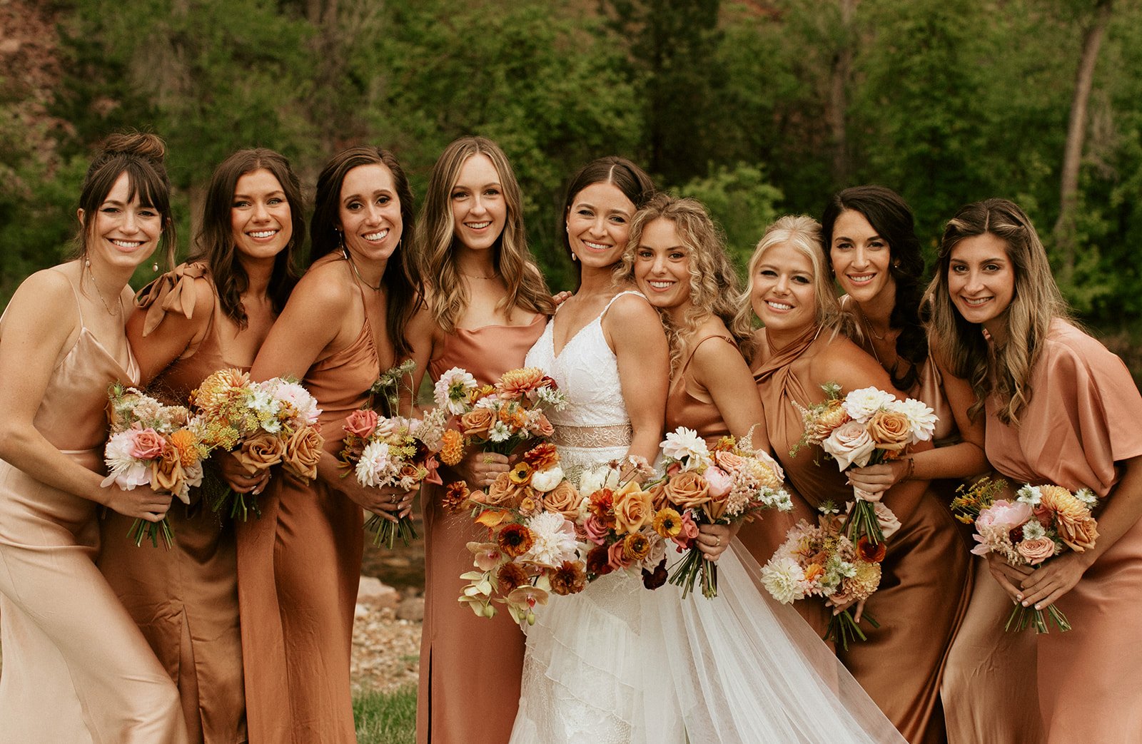  miss-matched bridesmaids rust colored gowns  terracotta color pallet  