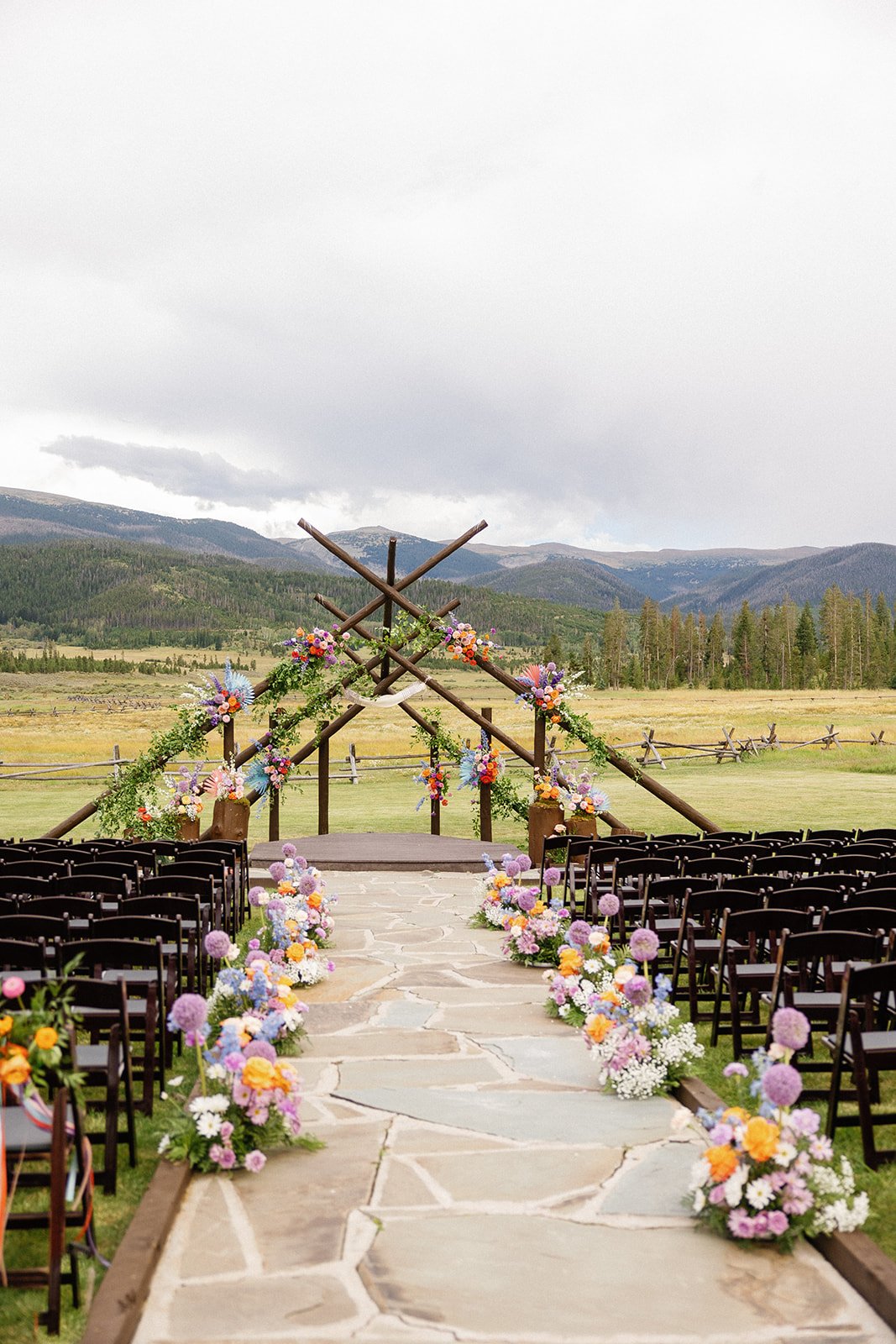  Devils thumb ranch colorado weddings bright florals pink flowers purple flowers orange flowers 