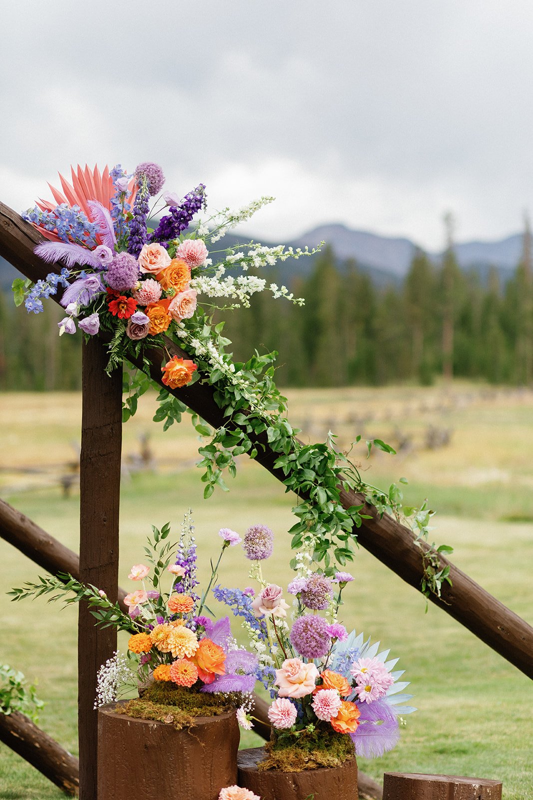  Devils thumb ranch colorado weddings bright florals pink flowers purple flowers orange flowers 