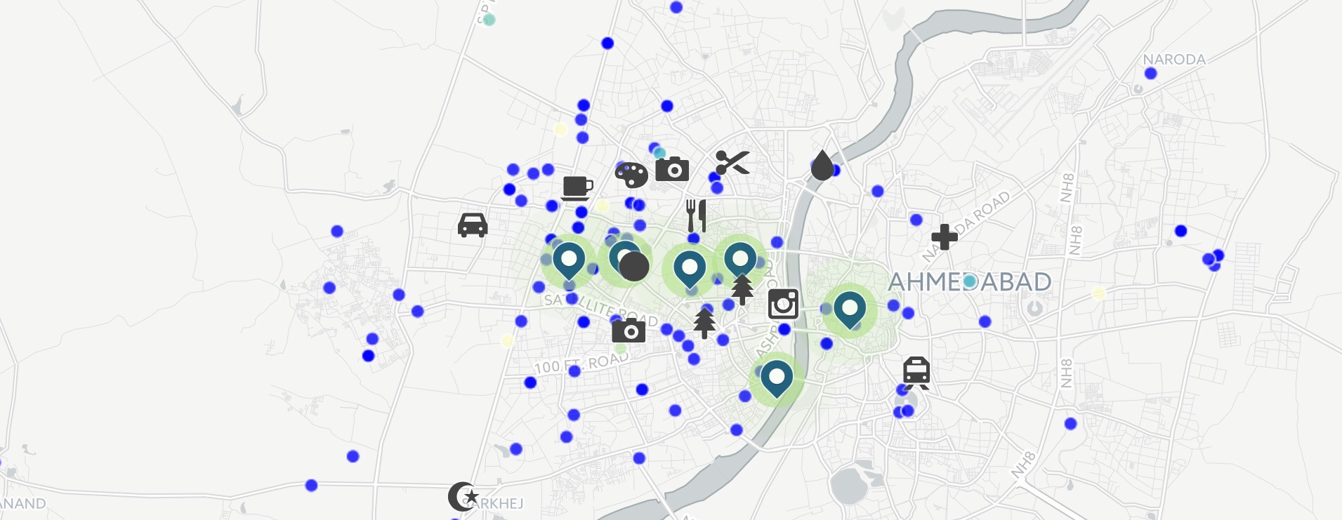 The markers represent Instagram posts, while the blue dots represent commonly used terms related to Ahmedabad on Twitter.