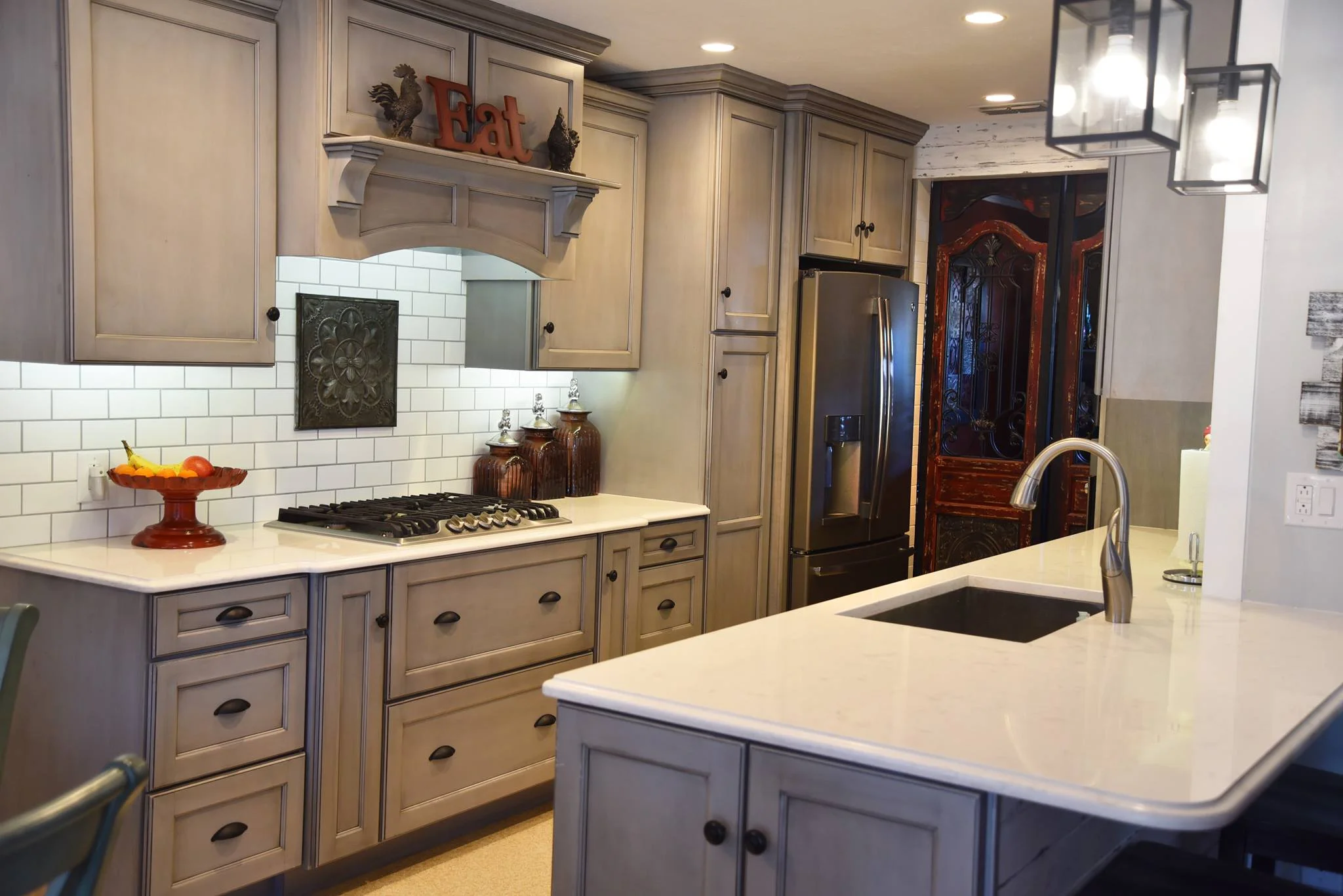 We supplied MidContinent Cabinetry: Ash with Black Glaze, Cambria Quartz Countertops: Style - Torquay, and a Soci Single Bowl Stainless Sink.