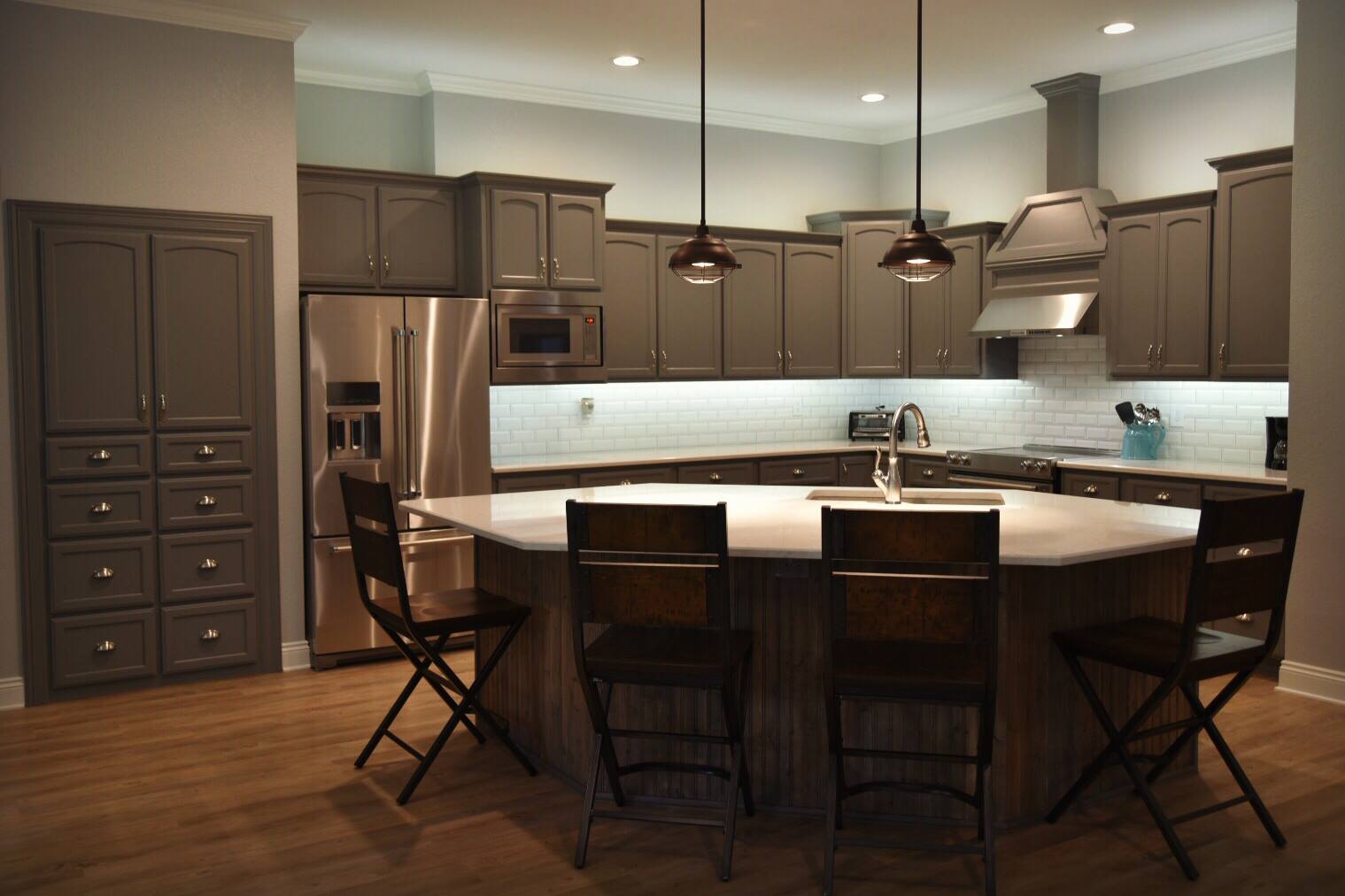  In this sleek, gorgeous kitchen from a new home in Texarkana we supplied the cabinet materials, Karndean flooring, Interceramic backsplash tile, and Cambria quartz countertops! 