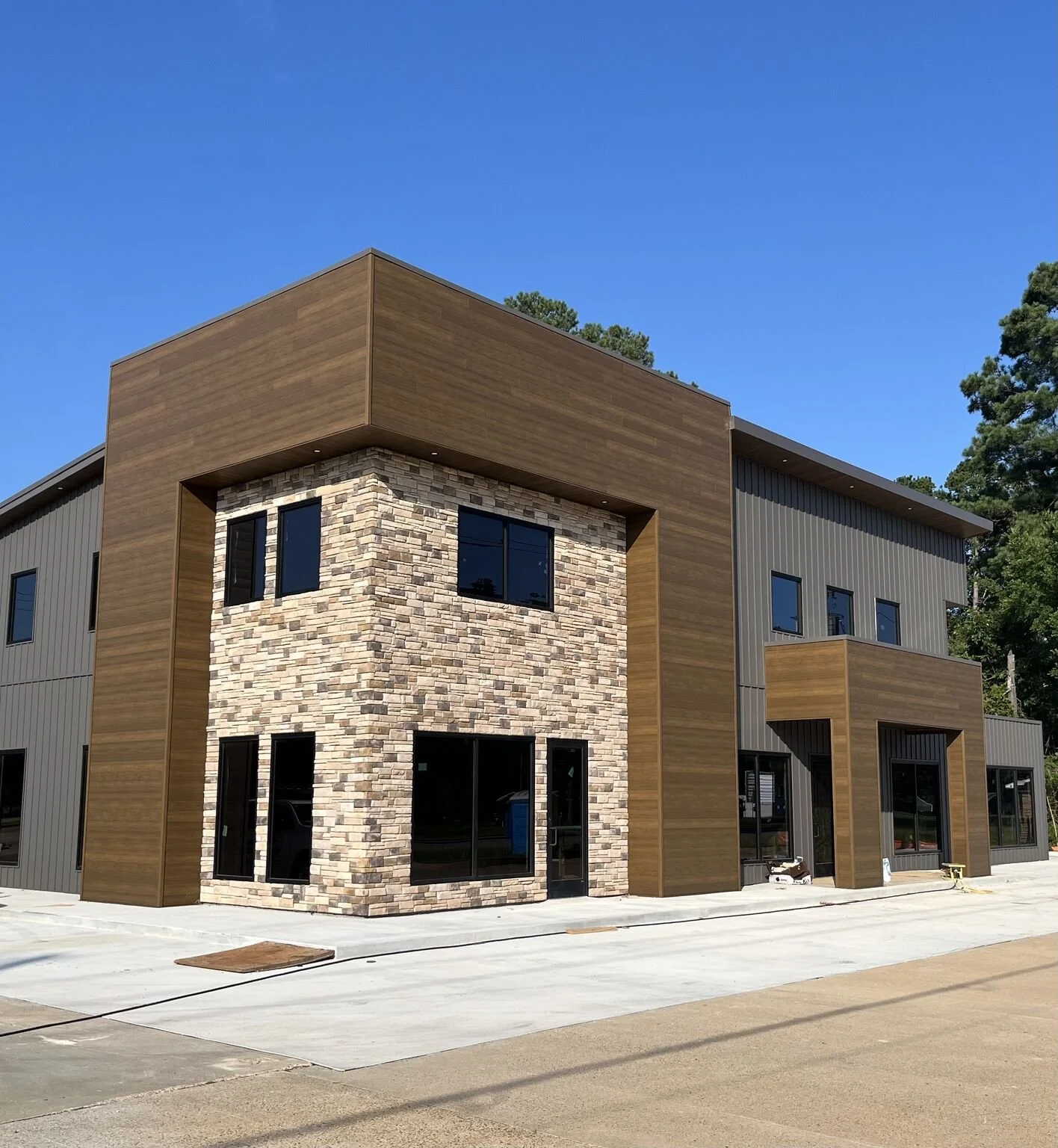 Another sharp project supplied by Red River Lumber.

This one features MAC Metal Architectural siding in the Harrywood Plus profile, shown here in Teak.

A strong option when the job calls for the look of wood with the durability of steel.
Want more 