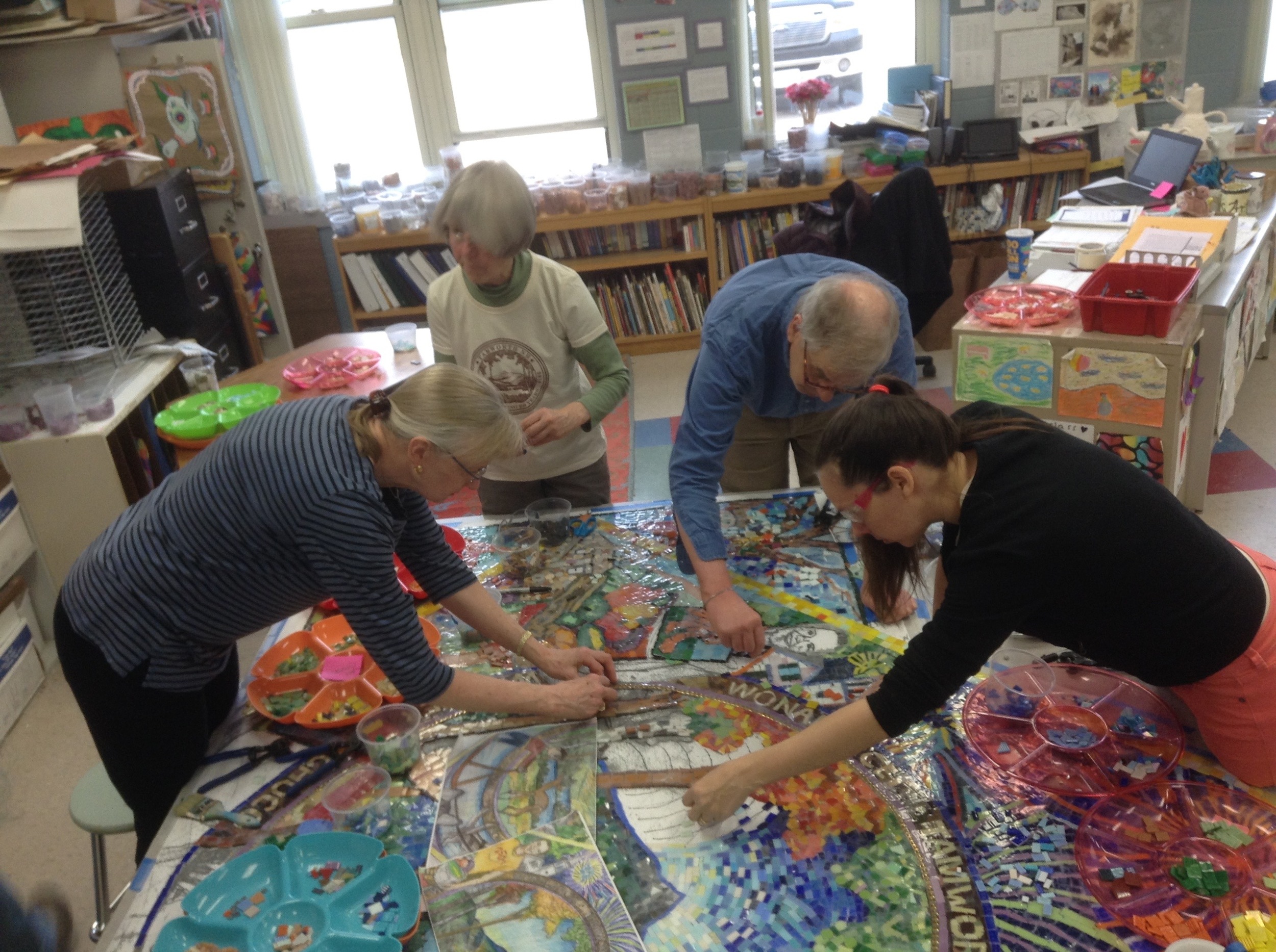 Working to finish the first mosaic to be mounted.