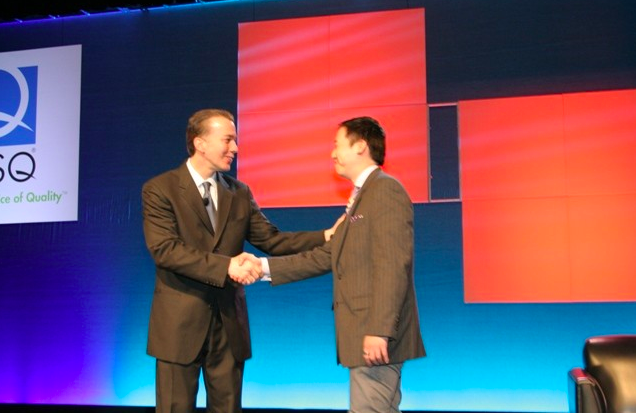 On stage with 2013 ASQ President John Timmerman for a congratulatory handshake during the medal ceremony.