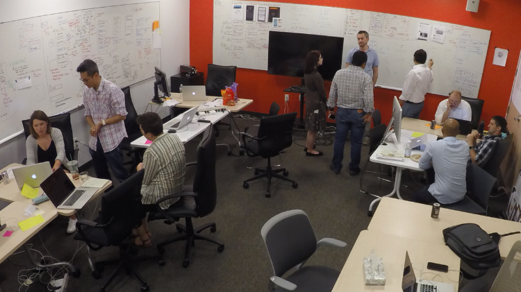 LEFT: Design building a prototype for testing | CENTER: UX, Dev, QA discussing login | RIGHT: UX, BA, SM writing stories