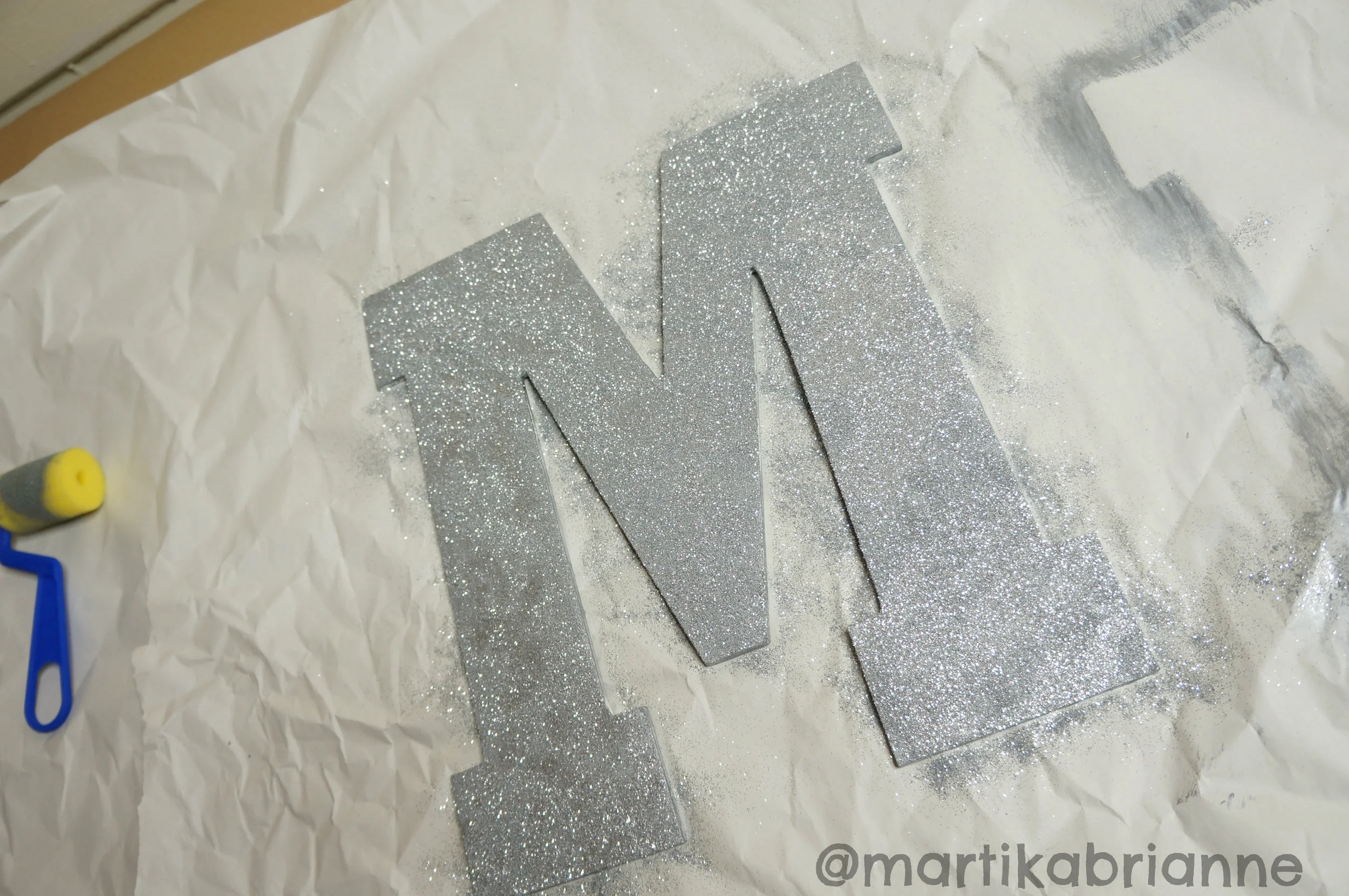 Spray glue, then sprinkle the glitter evenly!