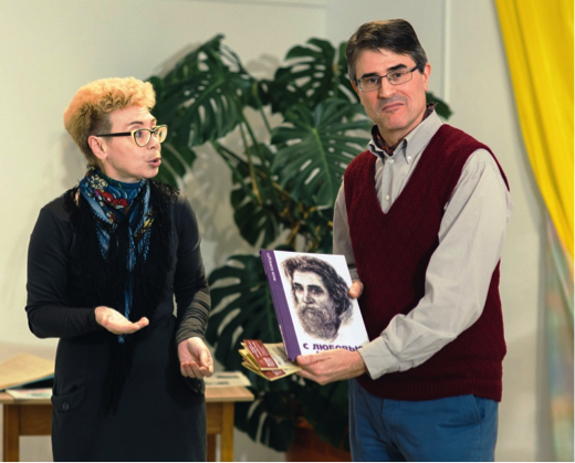 Alla Pavlovna presenting a book about a local artist, after the lecture. Photo: Andrei Kiryanov