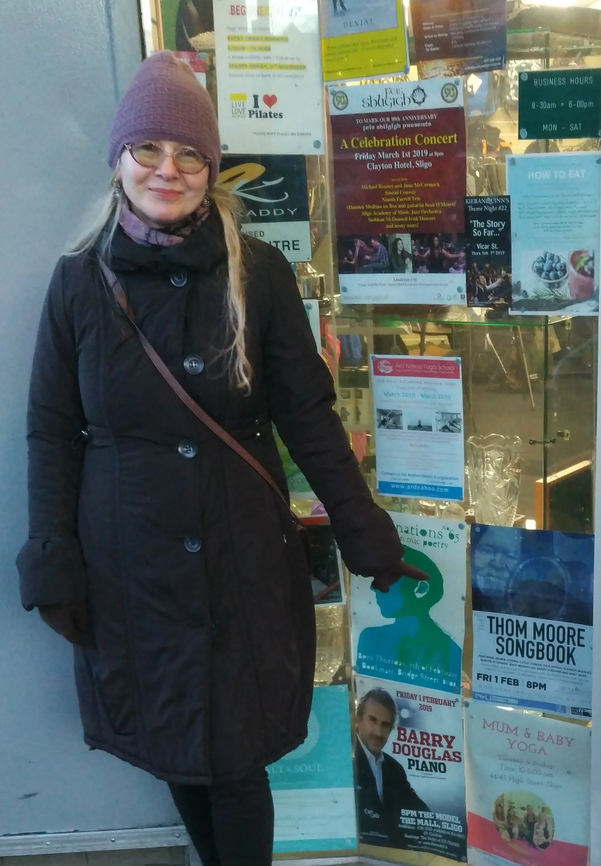 Lyuba Moore doing a spot check of concert promotion.