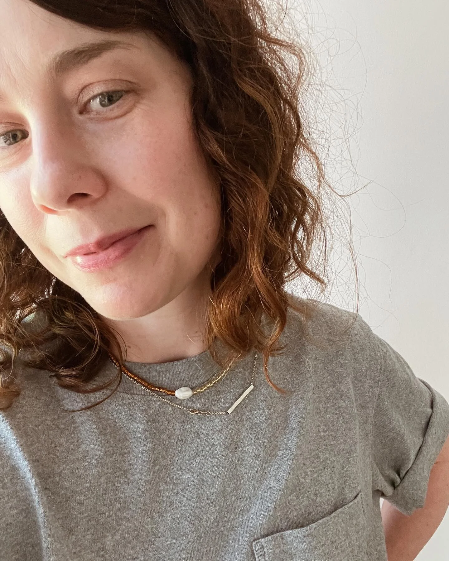 In my third year of wearing mostly just Reece&rsquo;s t-shirts, so layering things up with my fave old gold chain and a new pearl dream from @jules_vleugel - her stuff is so beautiful, very glad I aggressively and explicitly requested it for Christma
