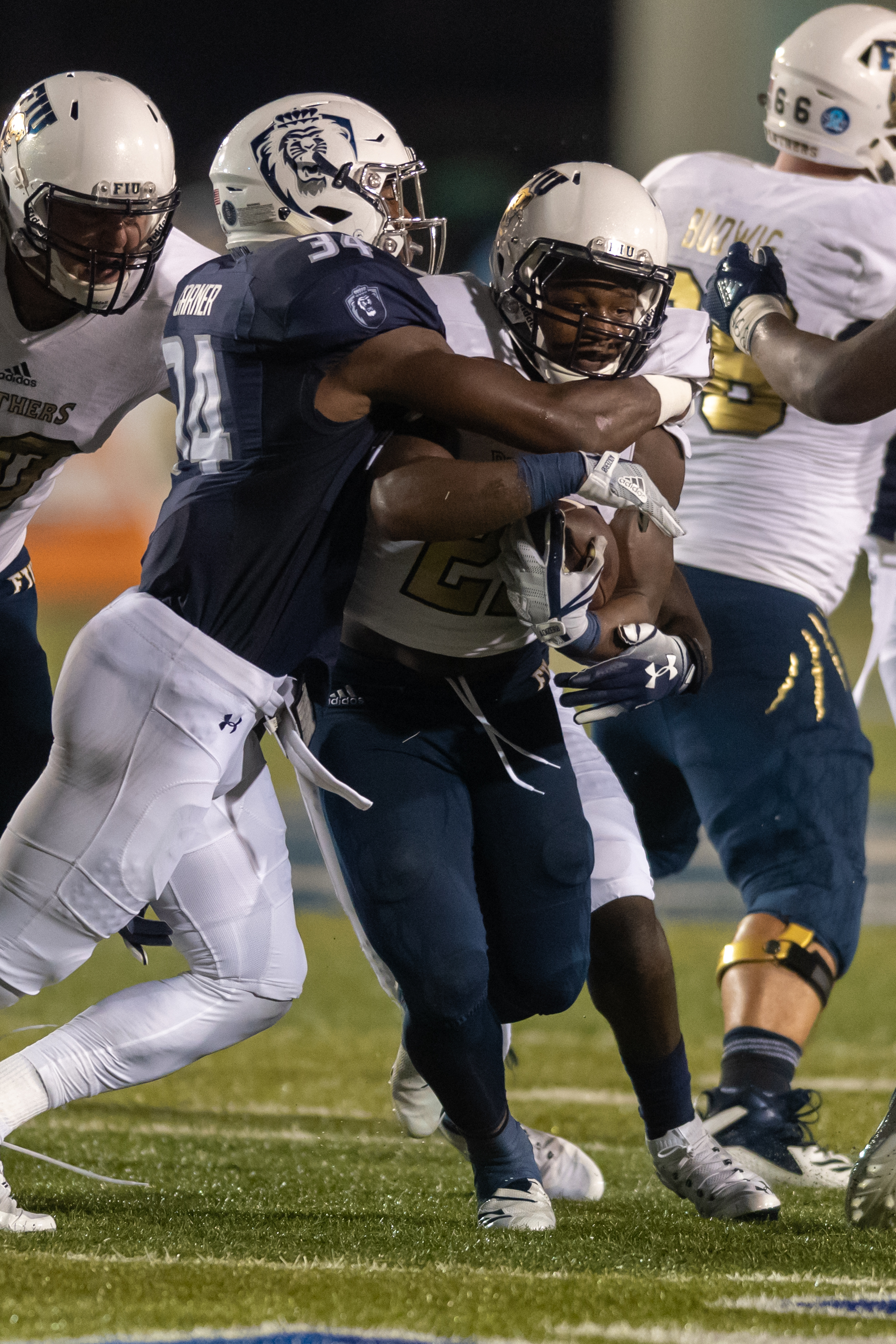  FIU Panthers running back Shawndarrius Phillips (22) runs the ball under pressure from Old Dominion Monarchs cornerback Joe Joe Headen (24) during the Saturday, Sept. 8, 2018 game held at Old Dominion University in Norfolk, Virginia. The Monarchs le