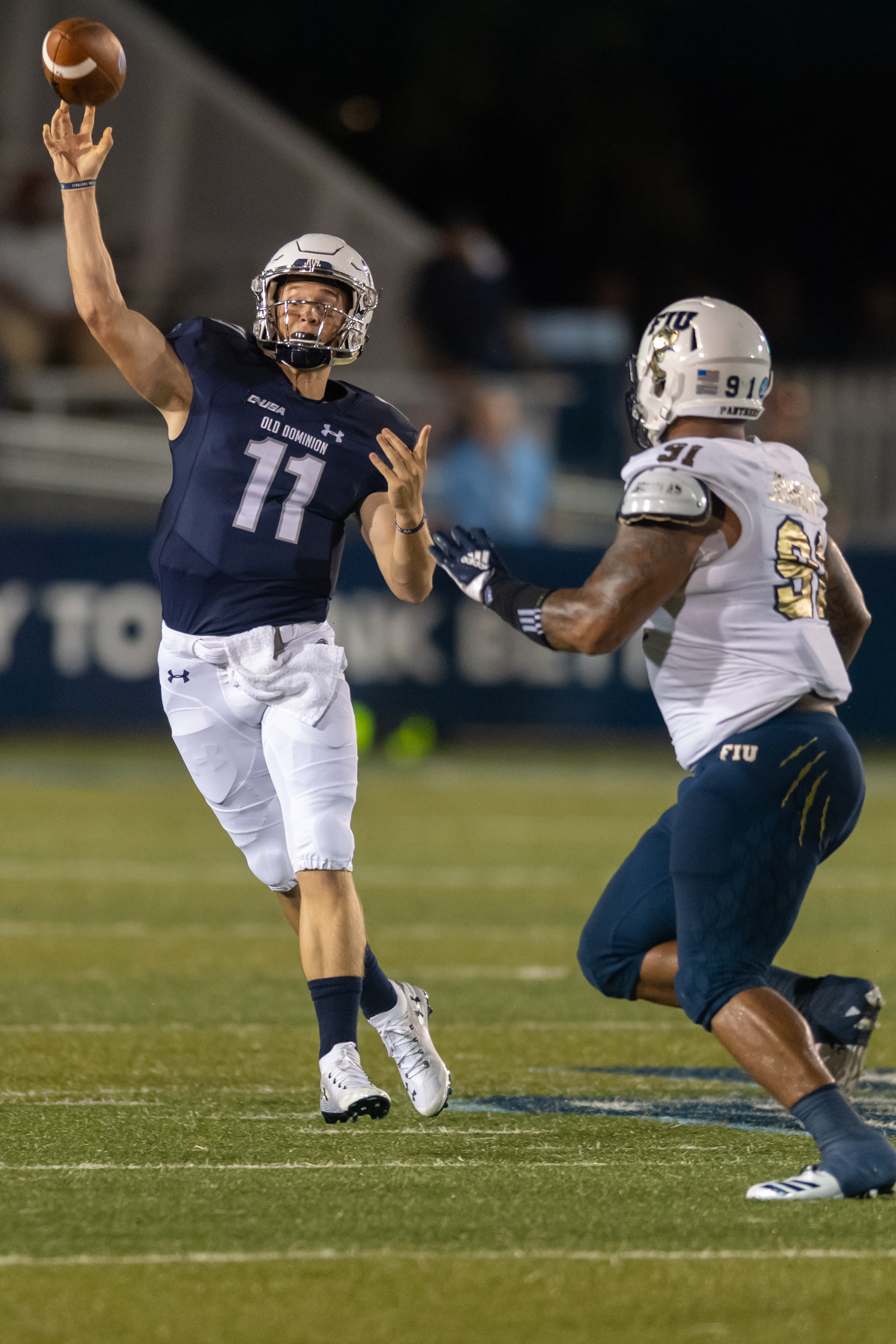 Old Dominion Monarchs quarterback Blake LaRussa (11) makes a pass under pressure from FIU Panthers defensive lineman Anthony Johnson (91) during the Saturday, Sept. 8, 2018 game held at Old Dominion University in Norfolk, Virginia. The Monarchs lead