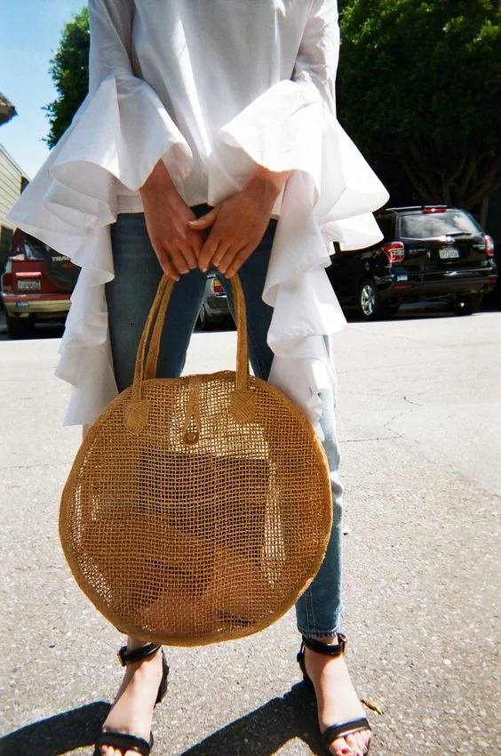 4. Minimalistic straw bag: I am obsessed with sleek, sophisticated (sometimes with a pop of color) bags. For this season, I am loving them in straw! I think it is such a feminine touch that elevates every look! Shop this gorgeous one here !