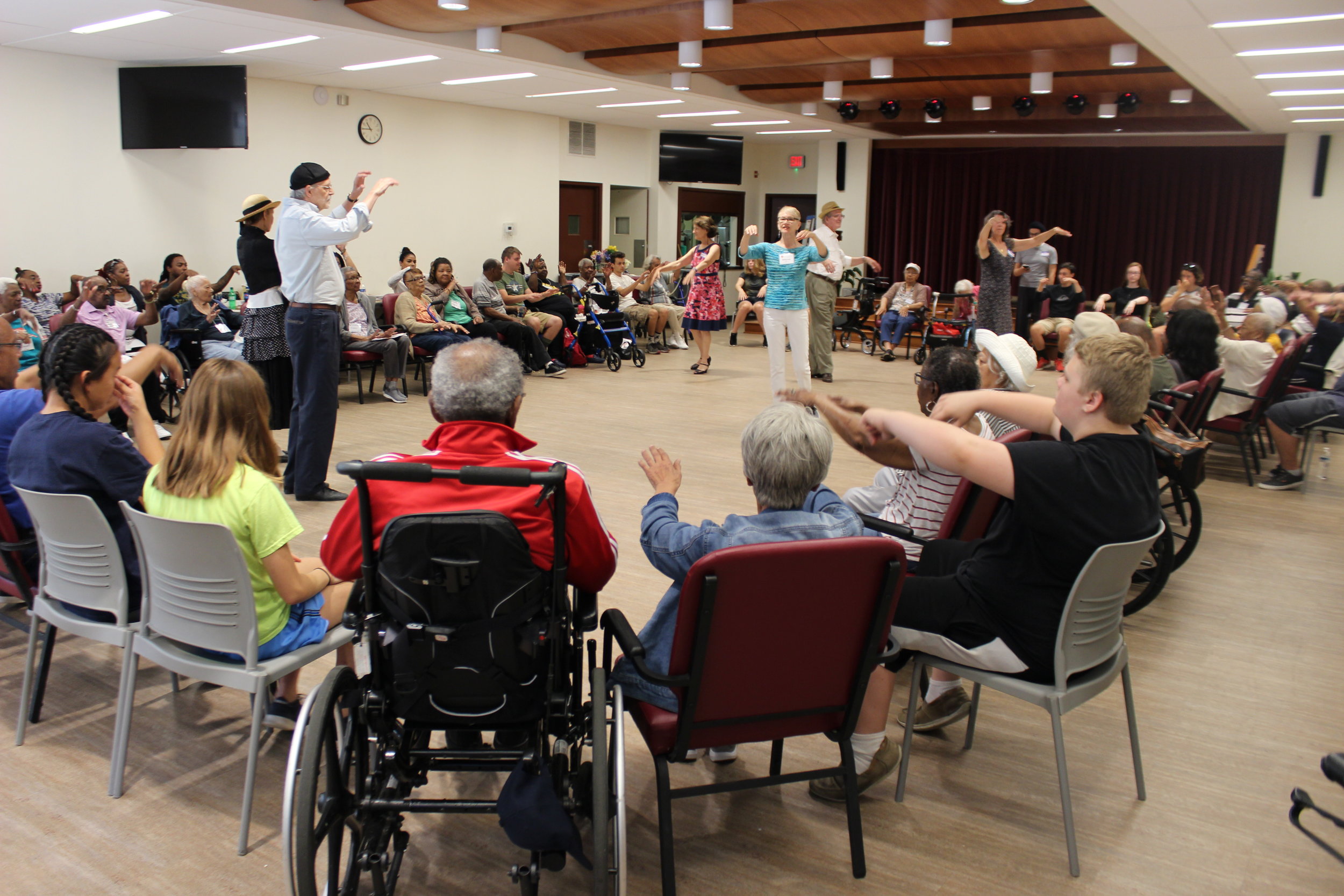  AFTA Teaching Artist Deborah Riley, with René Dávila and Tango Mercurio dancers, leads a warmup for older adults and City Service Mission students (photo by Flora Le) 