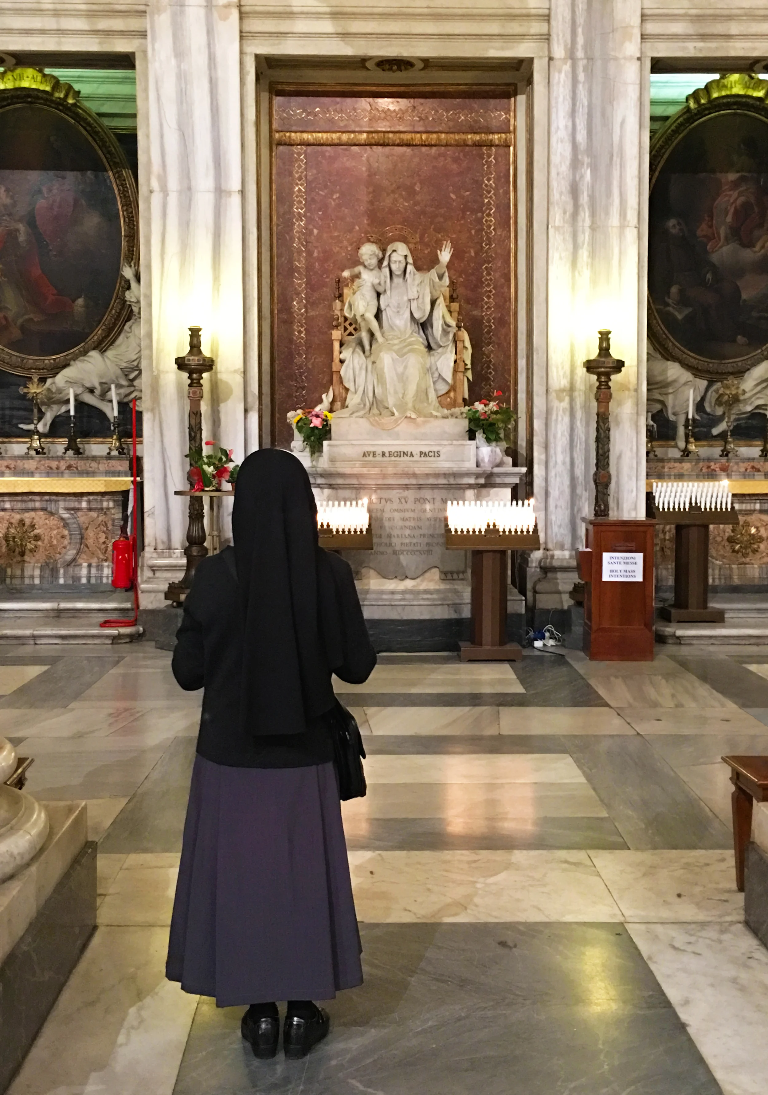 IMG_0505_iphone_nuninfront of alter_better.jpg