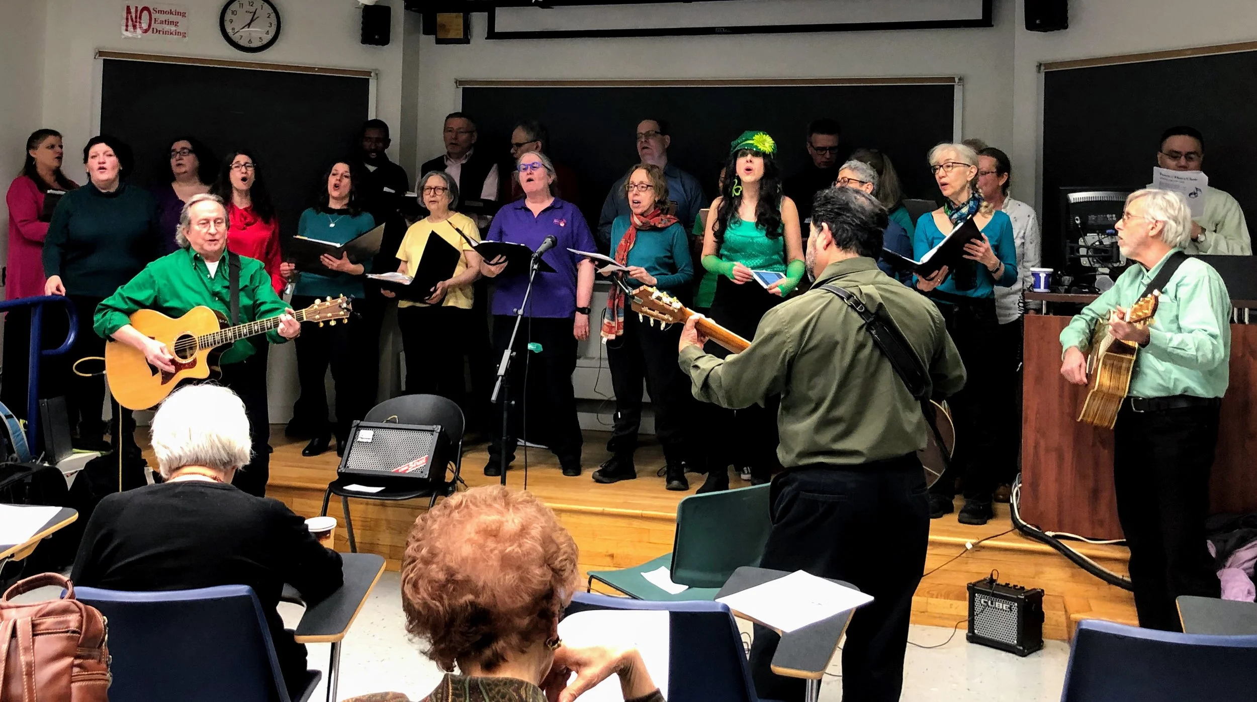 Three guitarists accompany the choir on the song, Fragile , performed at Sundays at JASA . JASA stands for the Jewish Association Serving the Aging .
