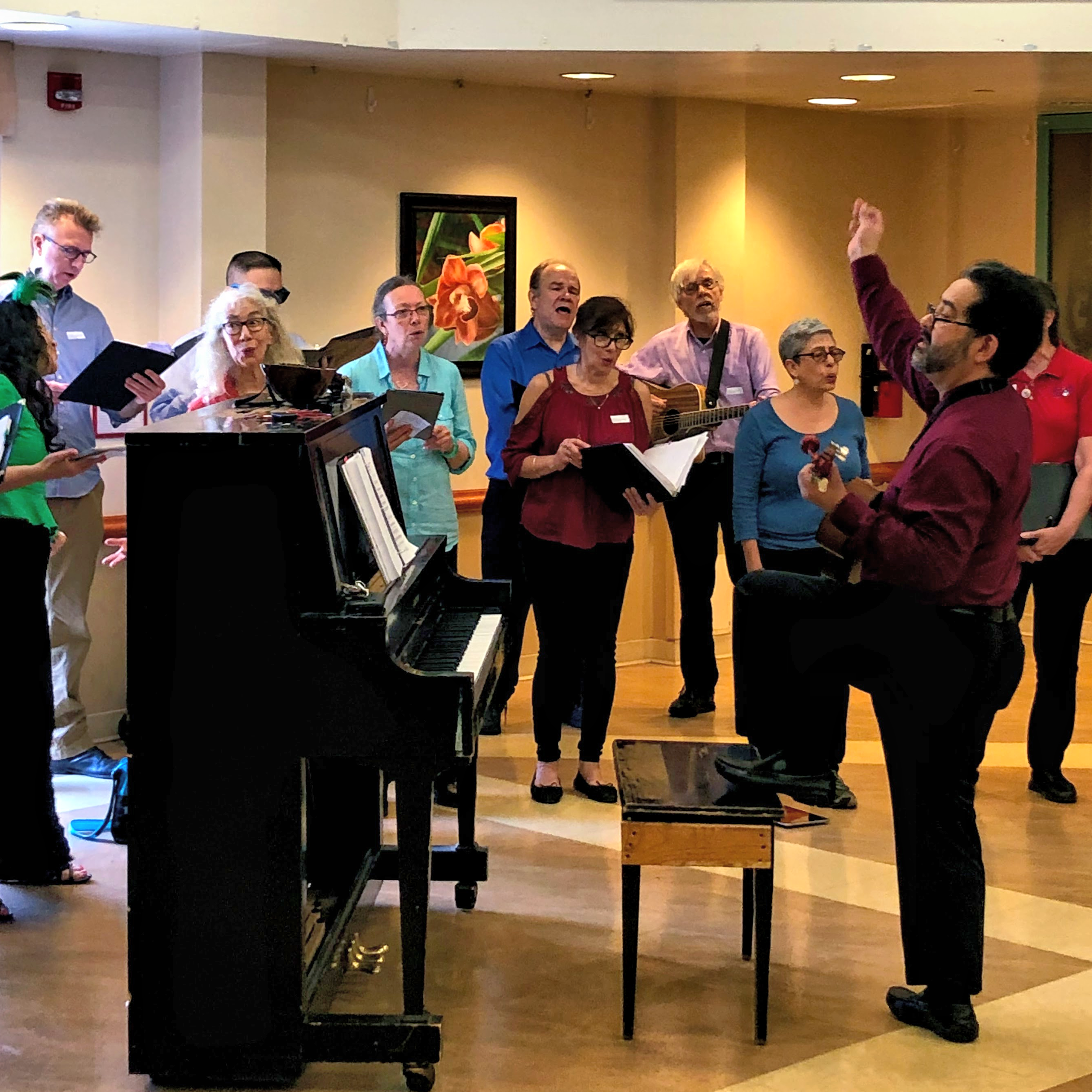 Maestro René Galván leads the choir in song
