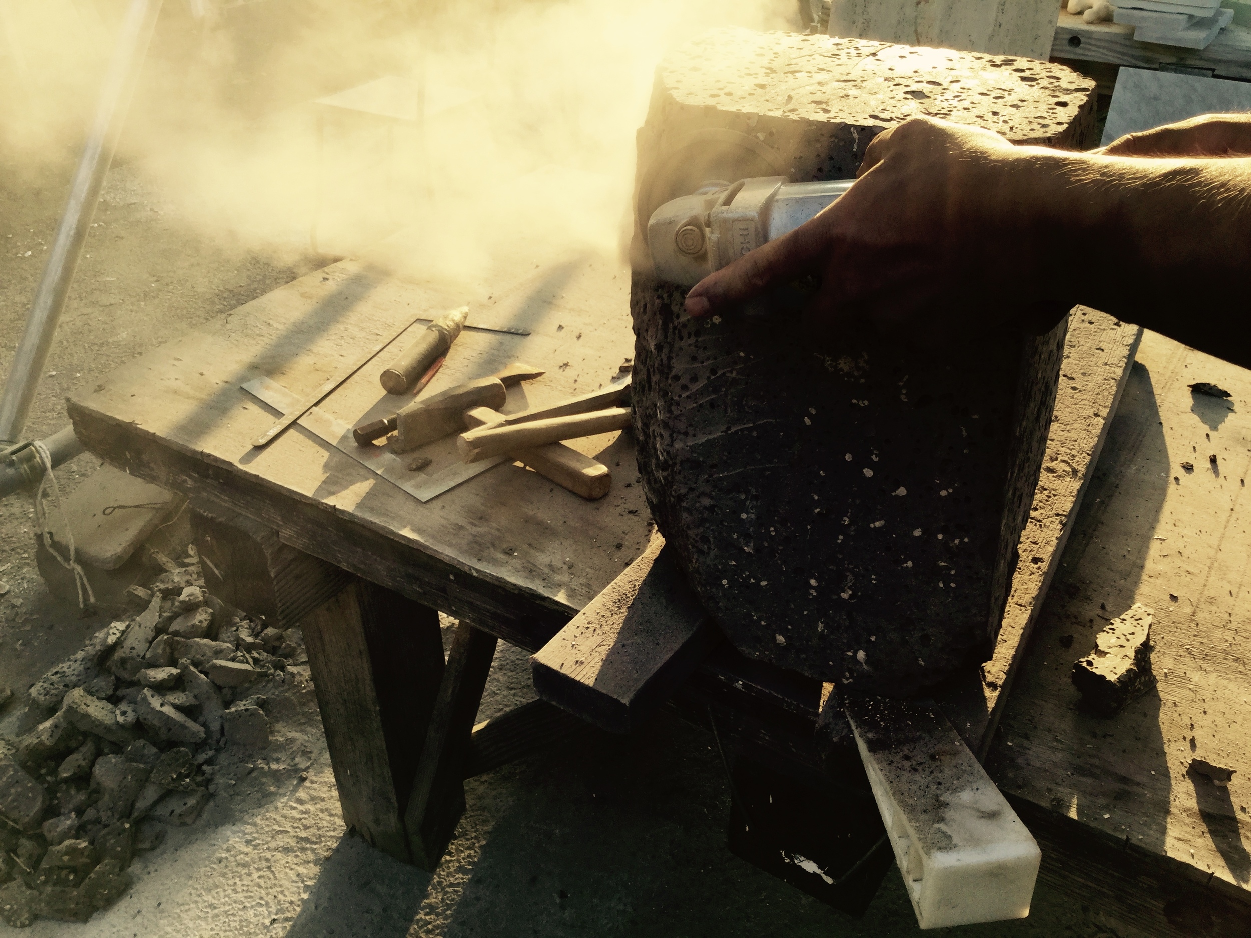 Lifting heavy boulders of volcanic rock, using heavy duty power tools and weighty iron hammers and chisels...possibly the manliest an artist could feel. 
