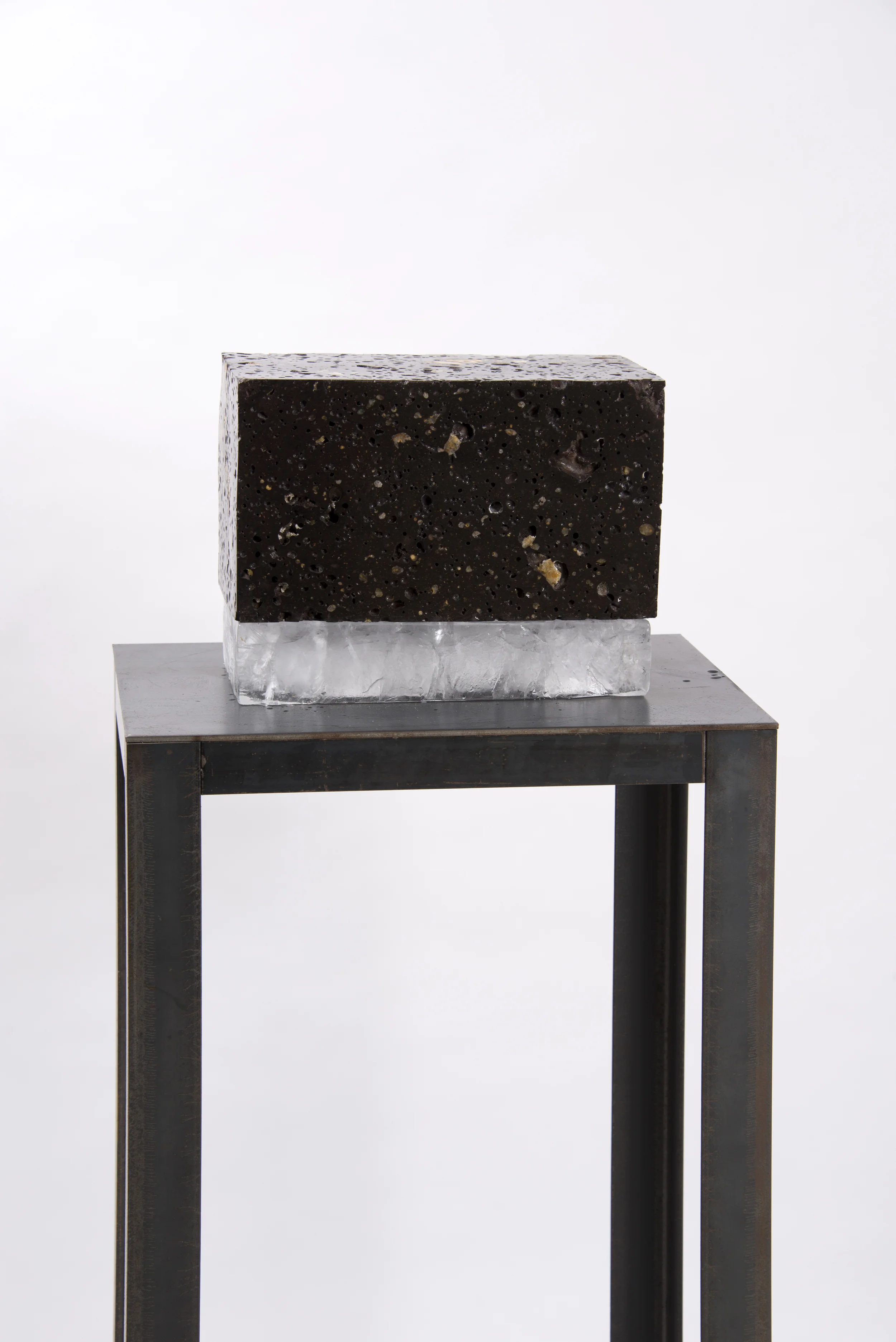 'Untitled', (volcanic rock and ice), 23 cm x 30cm x 16cm. I'm drawn towards the brief relationship of composure the two materials hold, wilst in there very nature untrue.