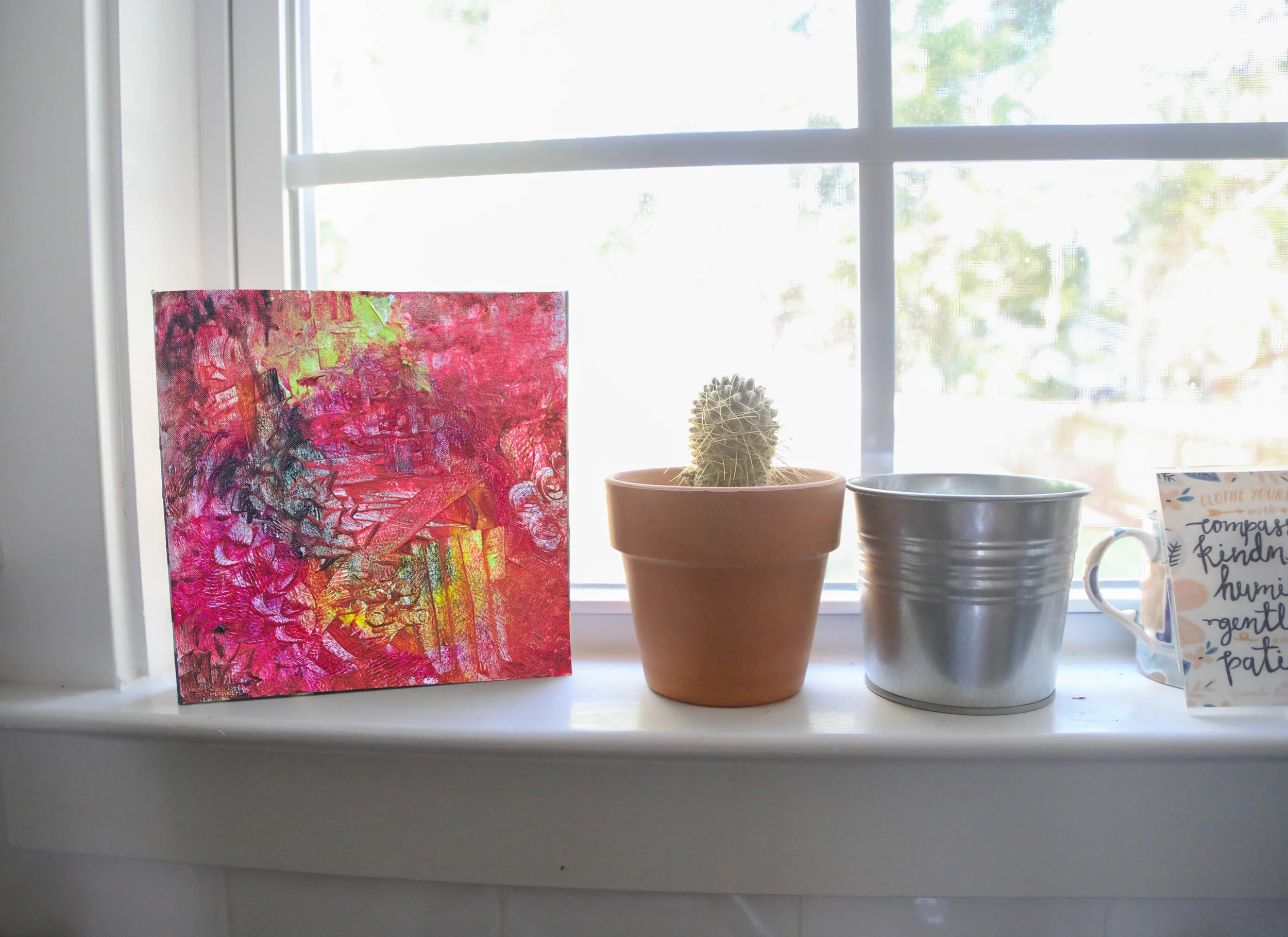 Emily's piece " Chrysanthemum" is on the windowsill 