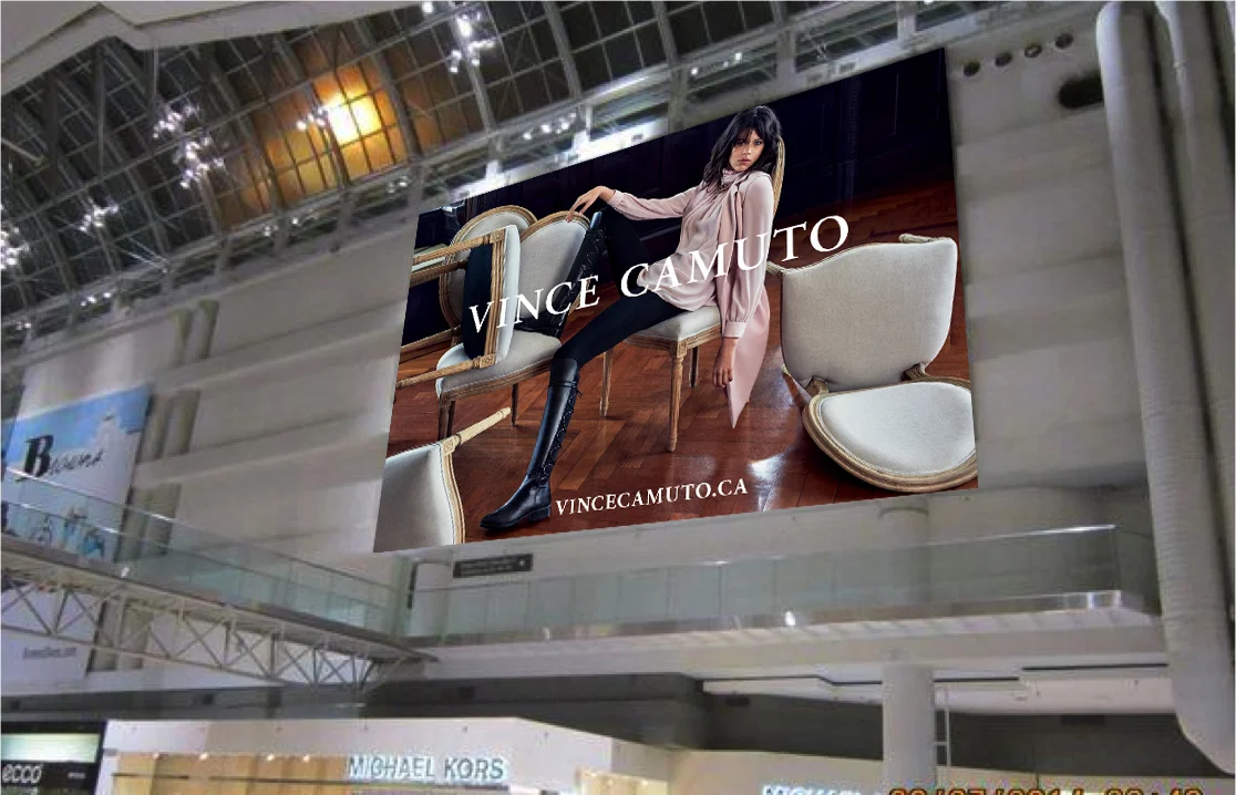 Mockup of Vince Camuto Billboard in its environment.