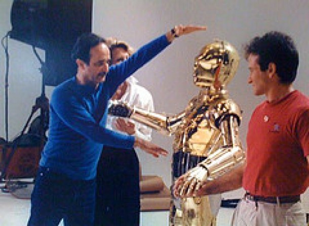 Robin Williams & C-3PO (Anthony Daniels) take direction while shooting the "Hands Across America" TV spot.