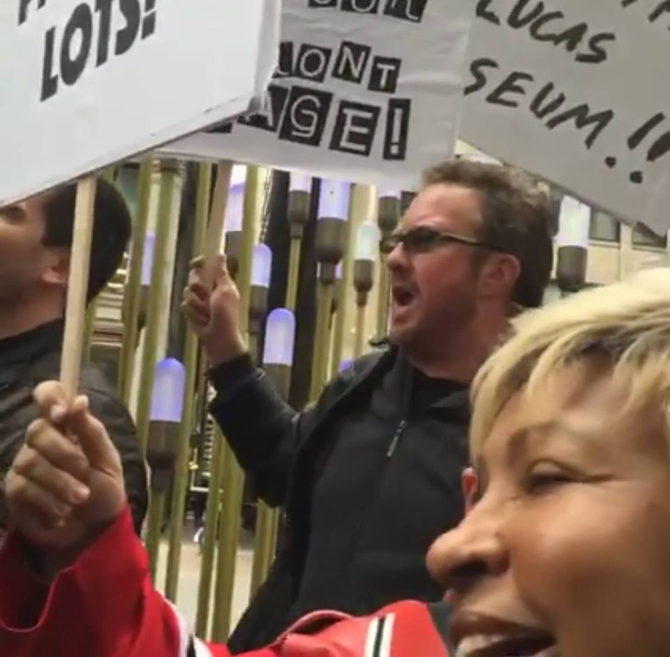 Jimmy Mac stands with the protesters outside the Friends of the Parks HQ in downtown Chicago to Save The Lucas Museum