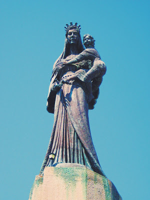 Madonna statue at the top of Church of Santa Maria del Soccorso