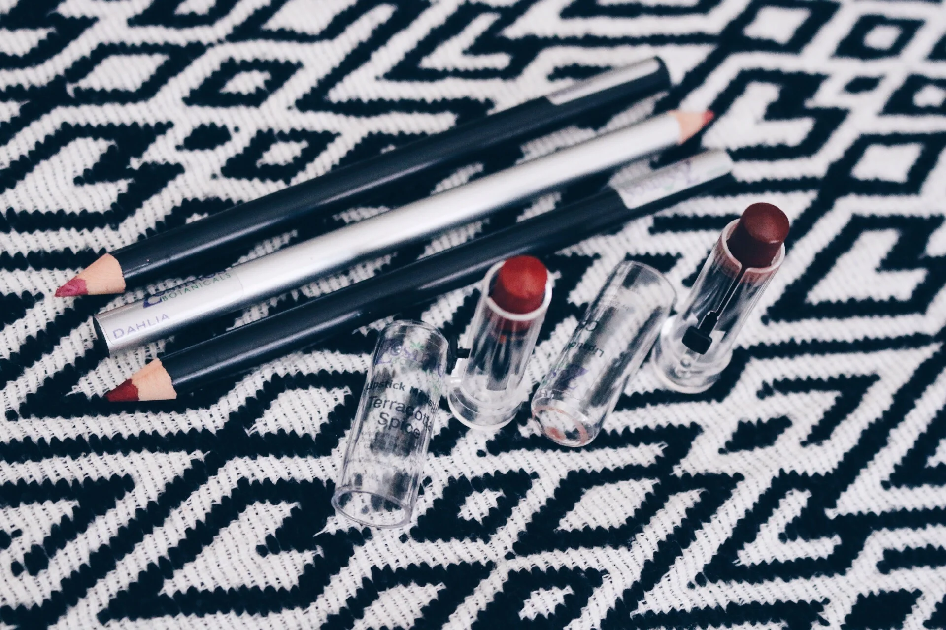 ZOSIMOS BOTANICALS LIP LINER (TOP-BOTTOM) IN "PEONY," "DAHLIA," AND "GARNET," AND LIPSTICK (L-R) IN "TERRACOTTA SPICE" AND "COCOA"