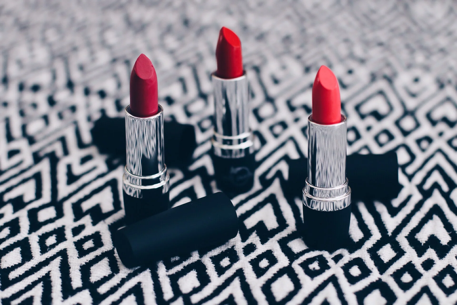 REAL PURITY LIPSTICK (L-R) IN "DEWBERRY," "CLOVER RED," AND "ROSE"