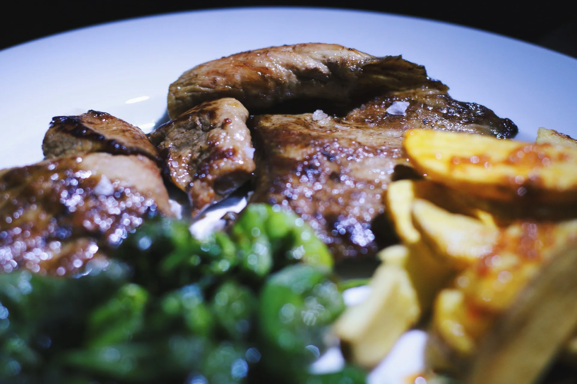 GRILLED IBERICO PORK WITH PIMIENTOS DE PADRON AND POTATOES