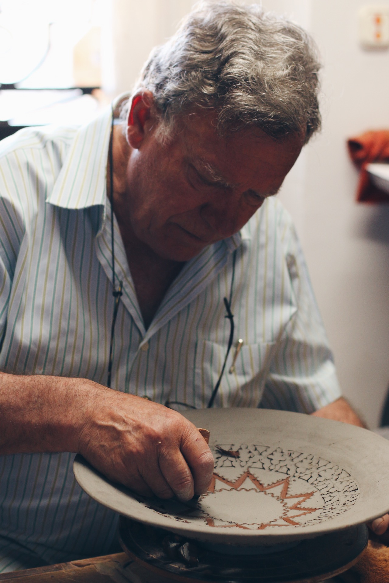 PACO JR SHOWING HOW THE INTRICATE CUT-OUTS ARE DONE