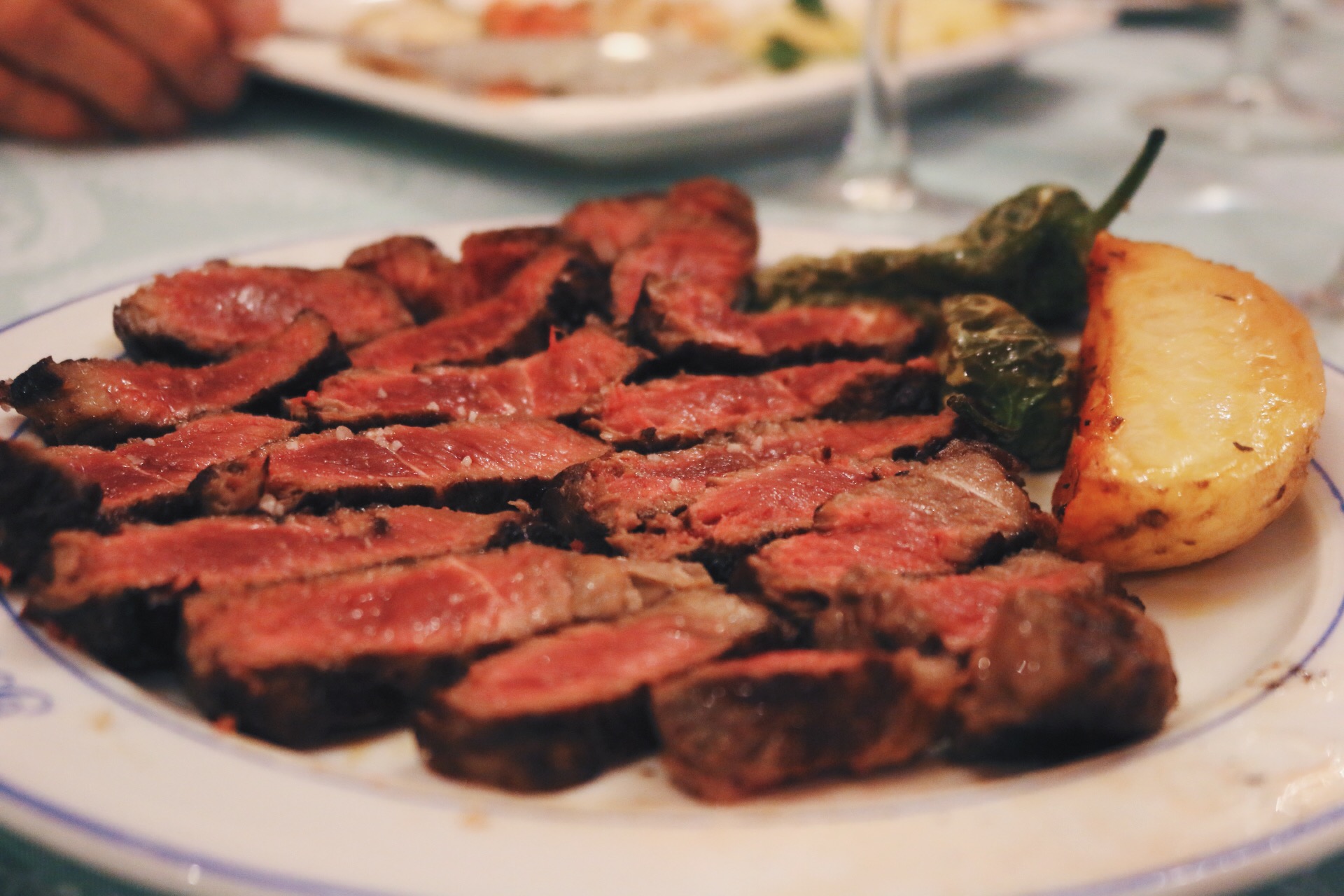 STEAK, POTATOES AND PIMIENTOS DE PADRON PEPPERS, FAMILY-STYLE 