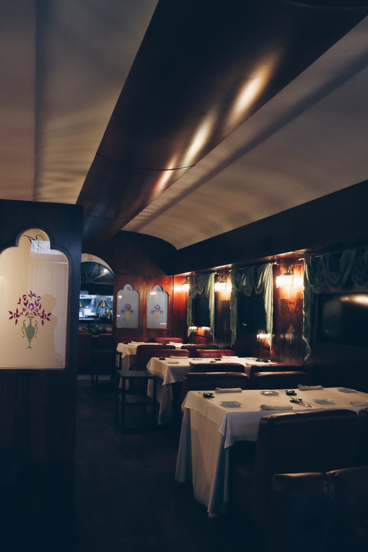 THE BACK DINING AREA DESIGNED LIKE AN OLD SCHOOL TRAIN