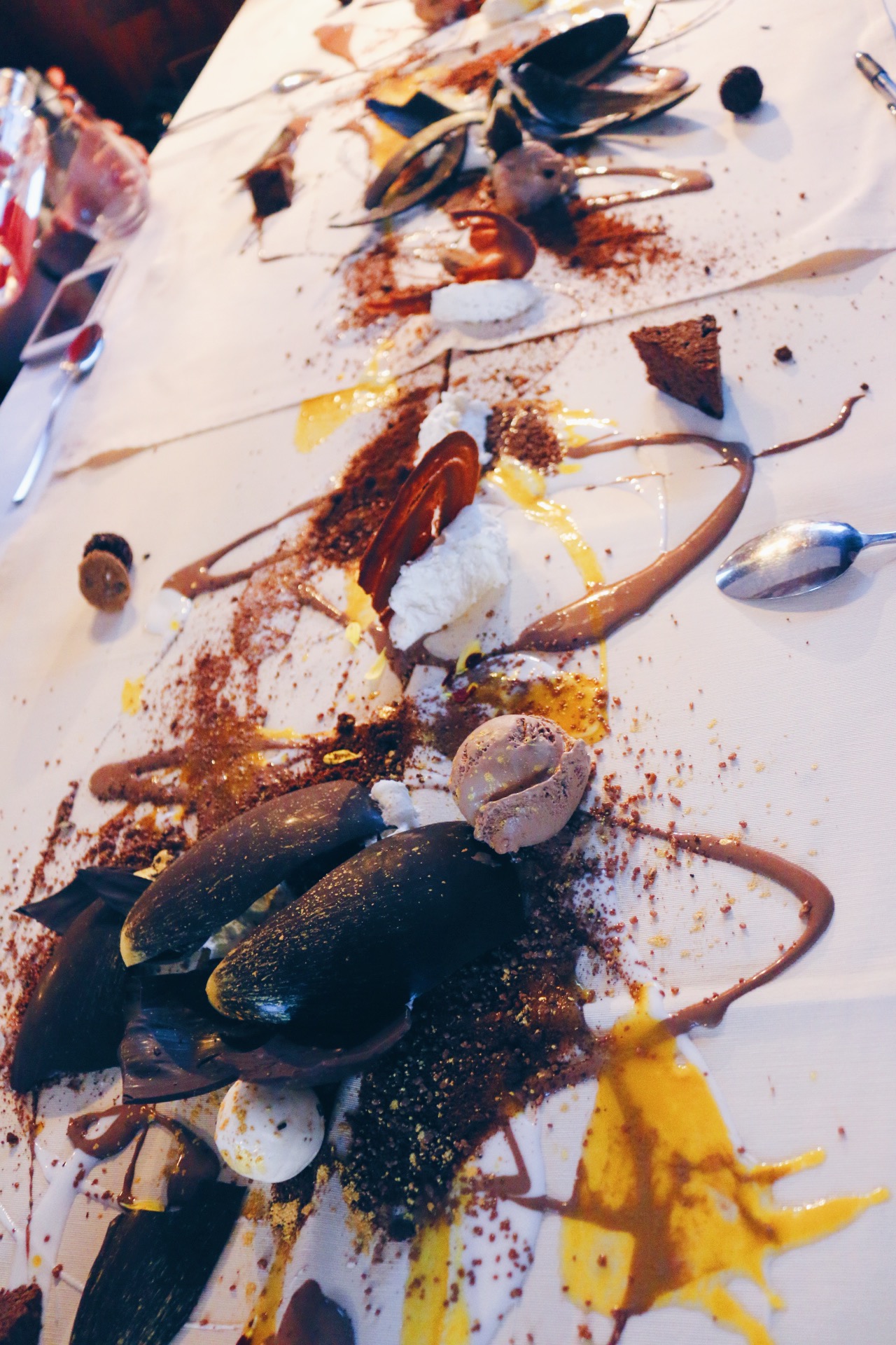 SPECIAL TABLE CLOTHS WERE LAID OUT AND THEN A JACKSON POLLOCK DESSERT CREATION ENSUED (VIDEO BELOW)