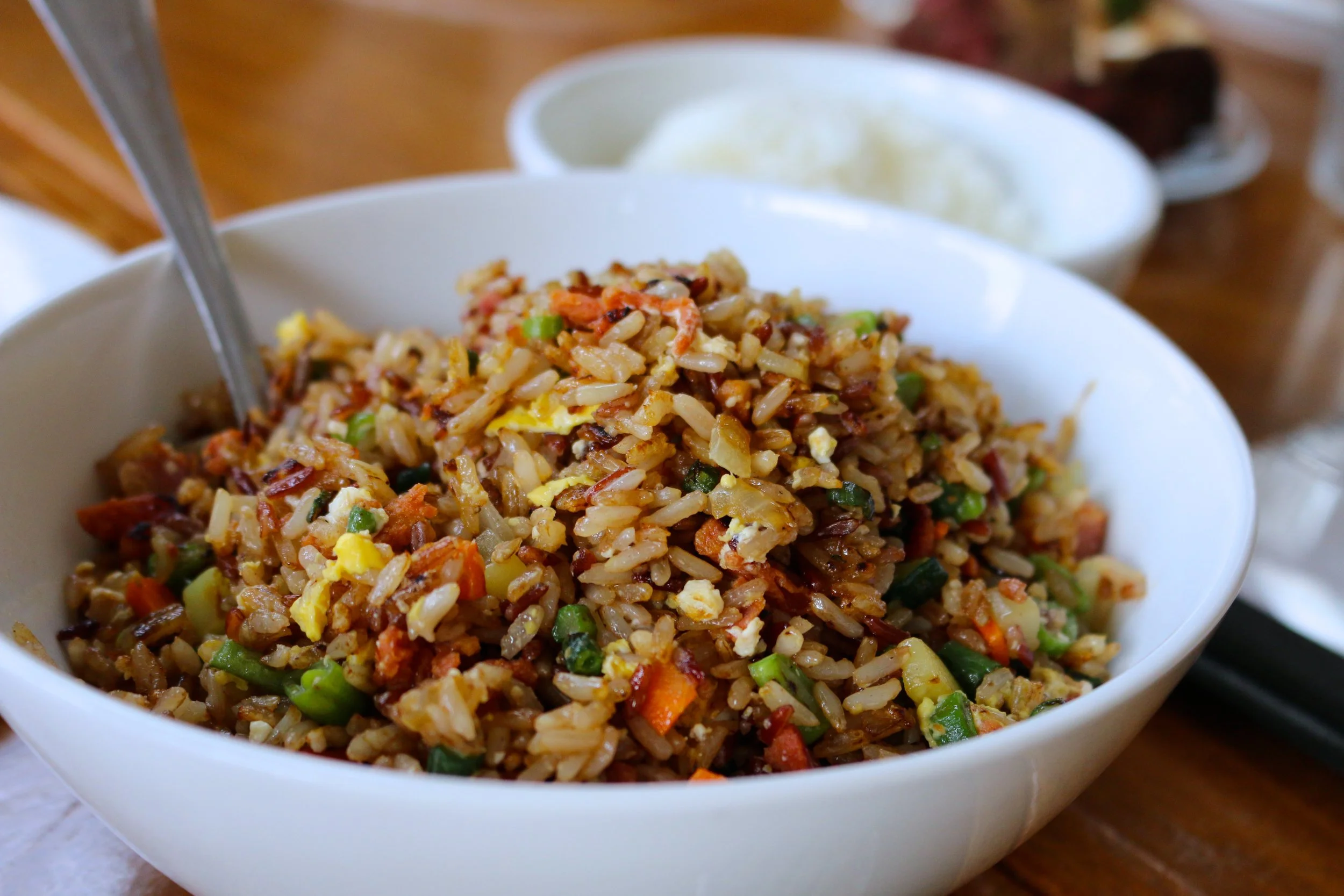 WILD BOAR FRIED RICE - GARLIC-SEASONED BROWN JASMINE RICE, KULANA WILD BOAR SAUSAGE, MARKET VEG, FRESH EGG.