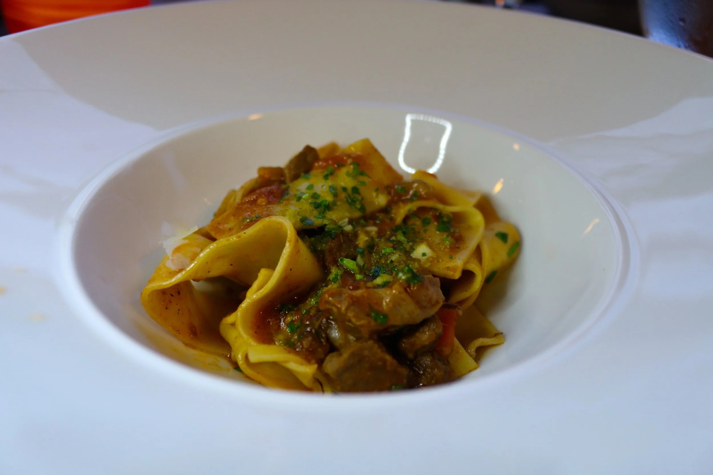 SLOW-BRAISED WILD BOAR RAGOUT WITH HAND-CUT PAPPARDELLE AND CITRUS GERMOLATA