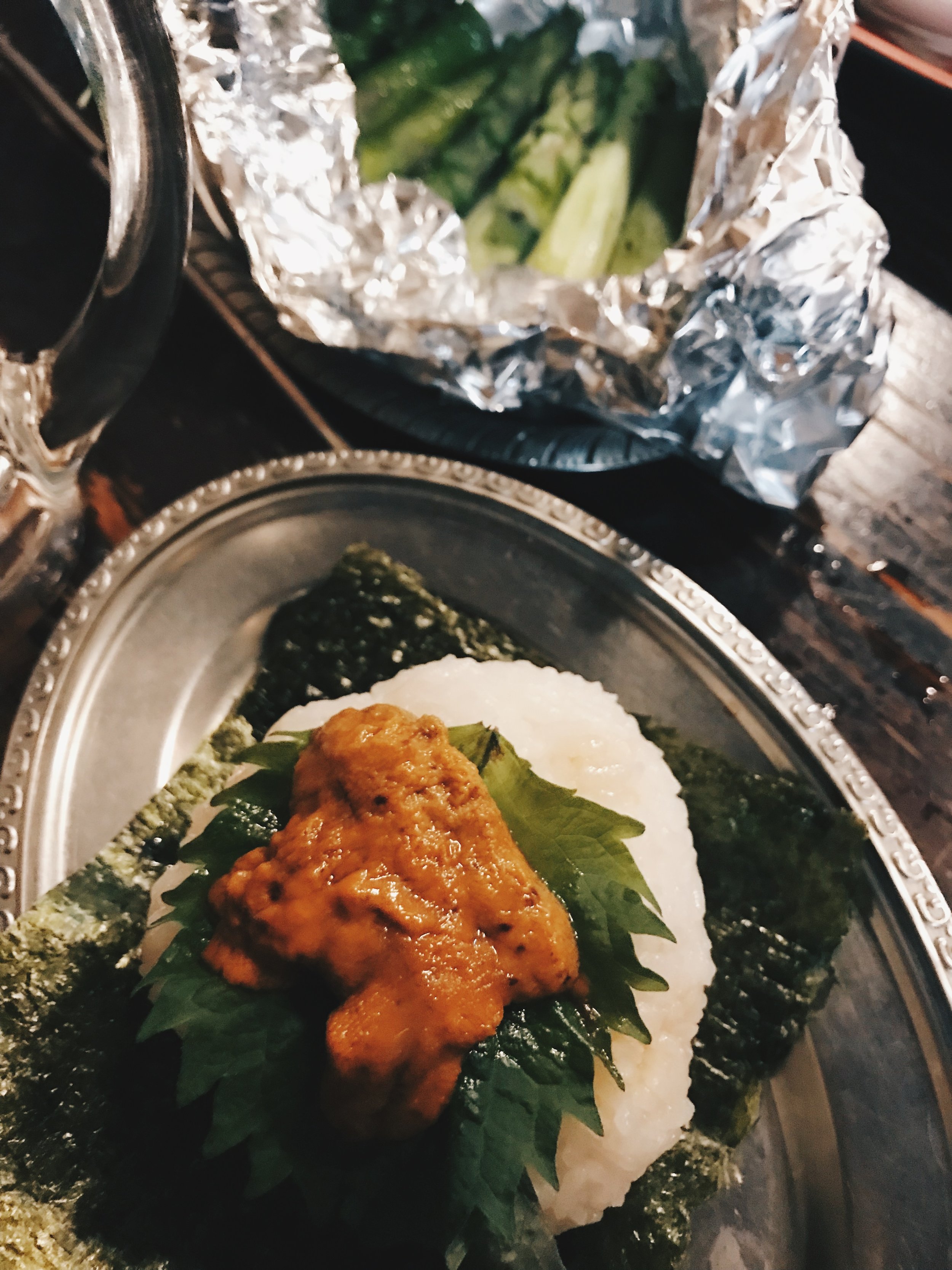 A giant uni with shiso onigiri at Gyumaru at Ebisu Yokocho
