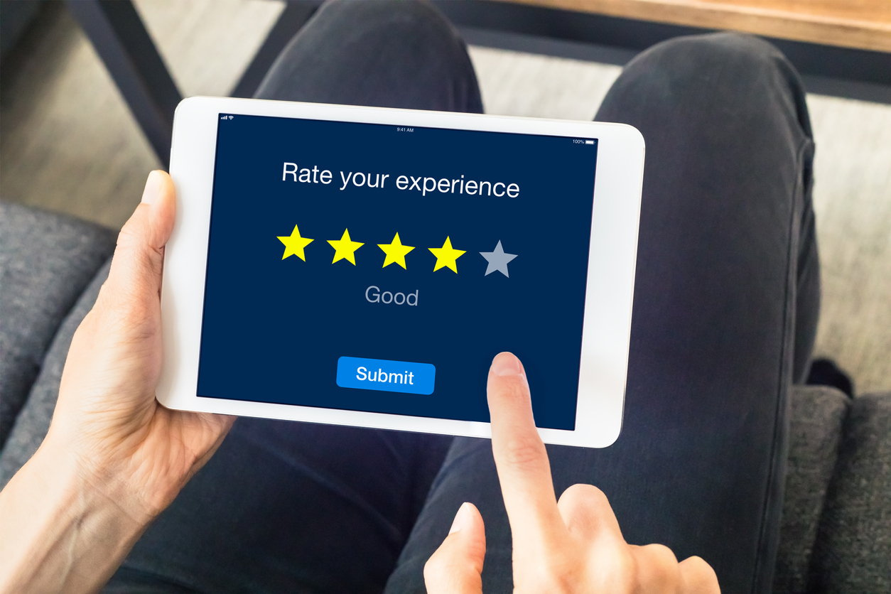 Person-using-digital-tablet-computer-sending-customer-rating-online,-stars-871604976_1258x839.jpeg